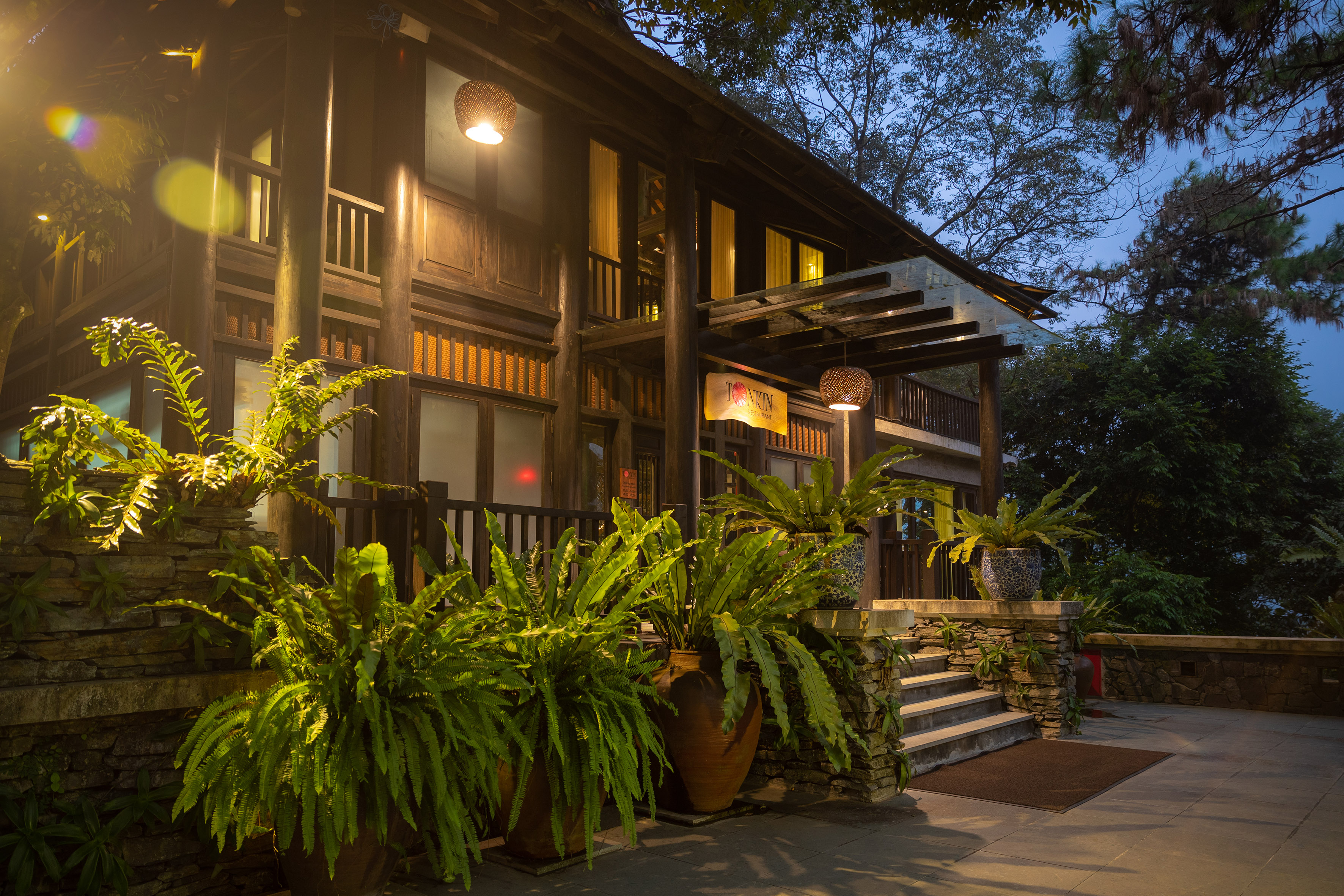 a building with plants in pots