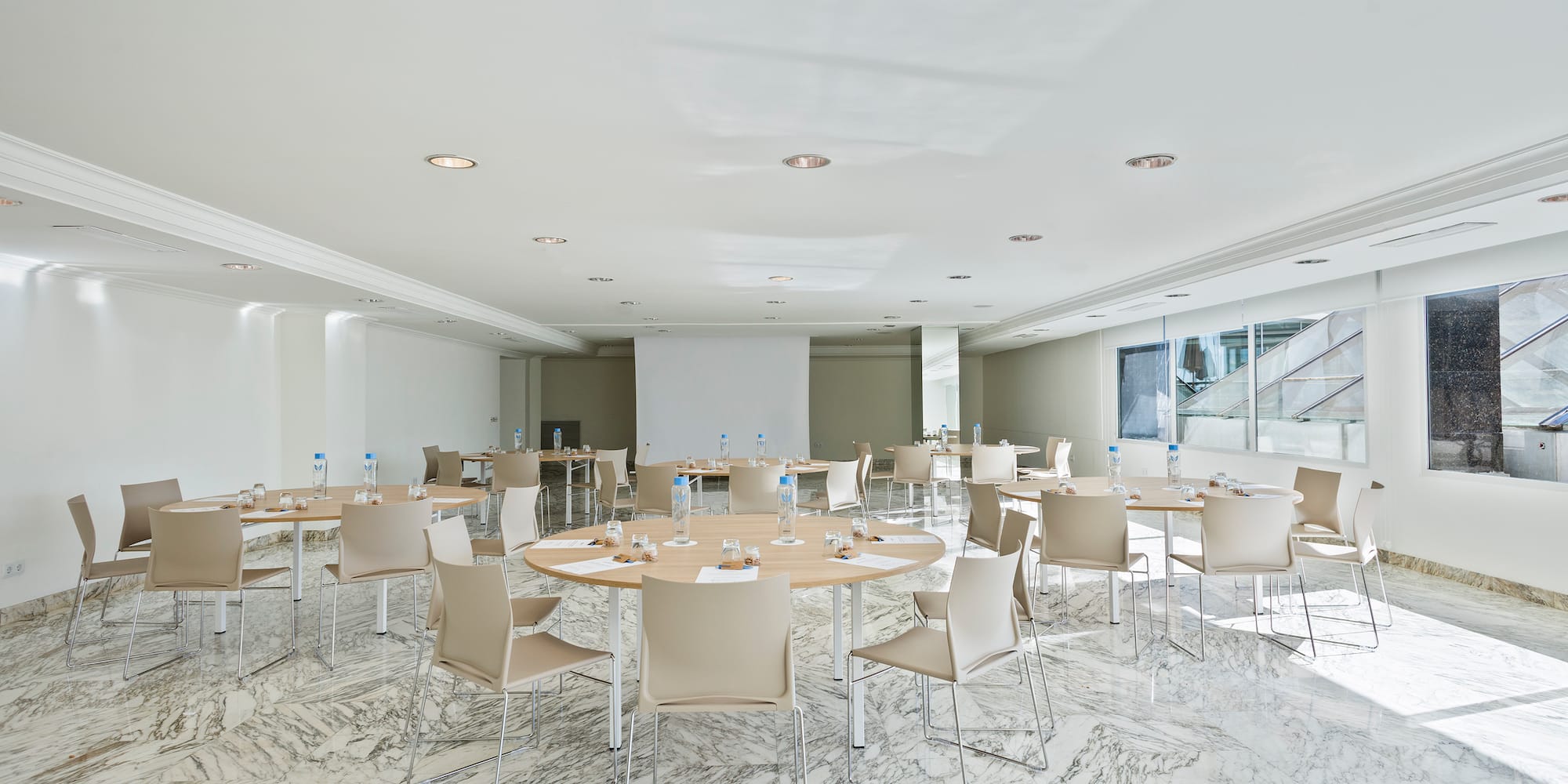 a room with tables and chairs