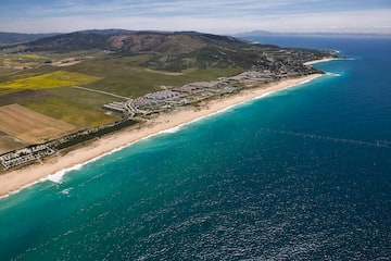 a beach with land and water