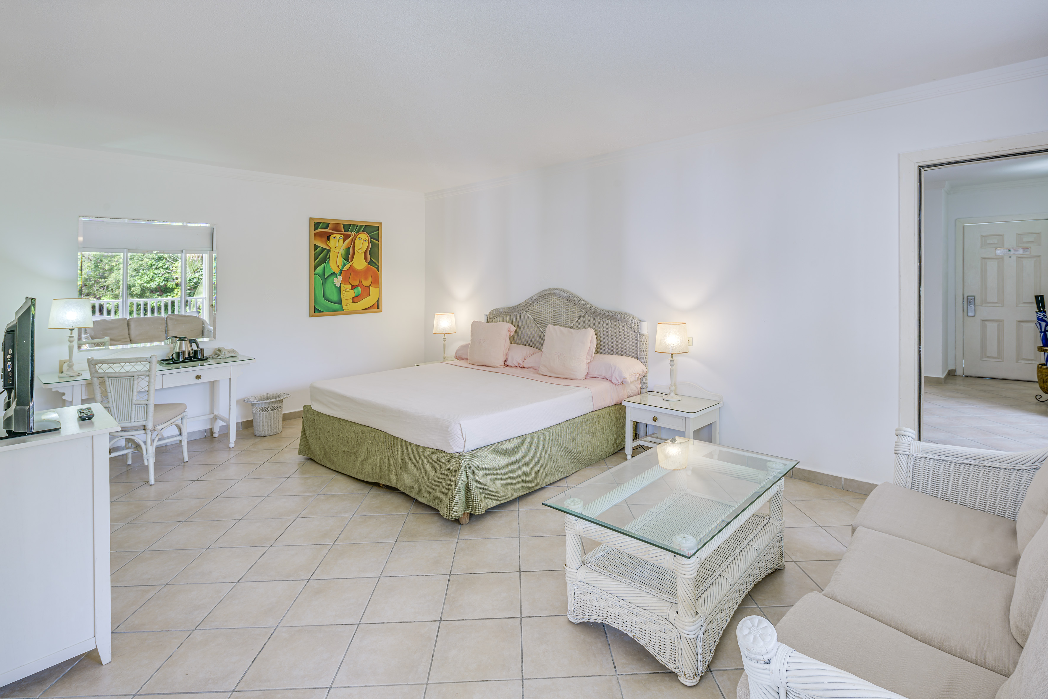 a bedroom with a bed and a table