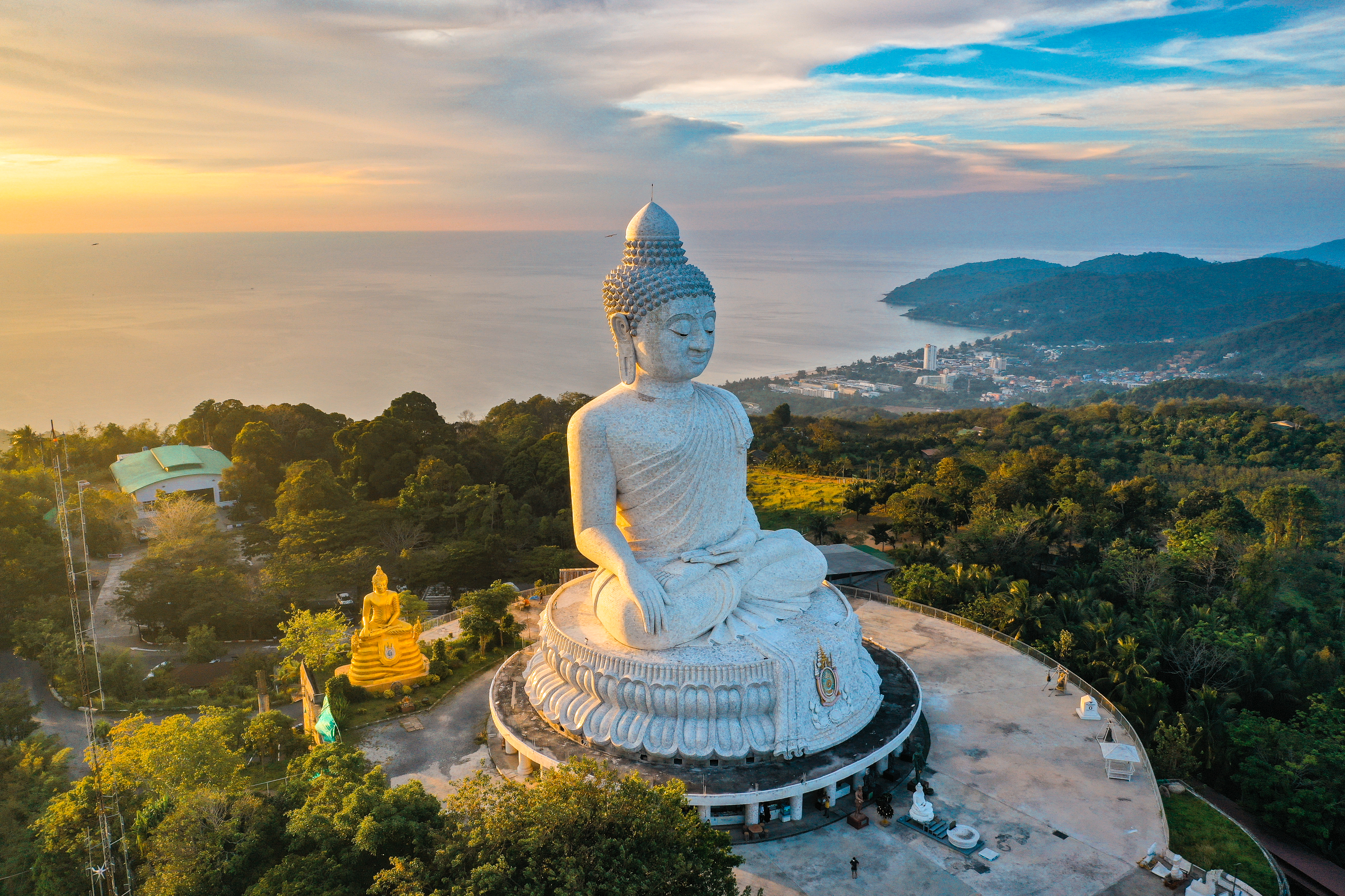 a large white statue of a buddha