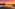 a sunset over a lake with fishing nets