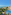 Sprawling beachfront resort with pools, large hotel buildings, and clear blue sea.