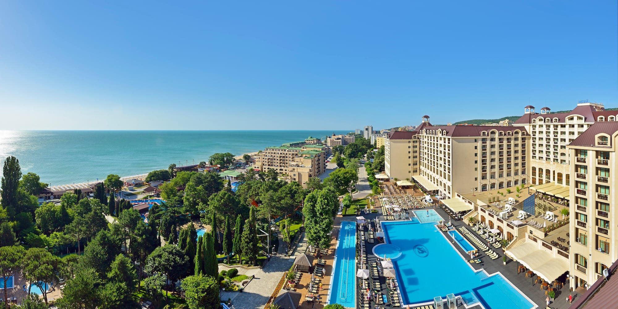 a swimming pool next to a beach