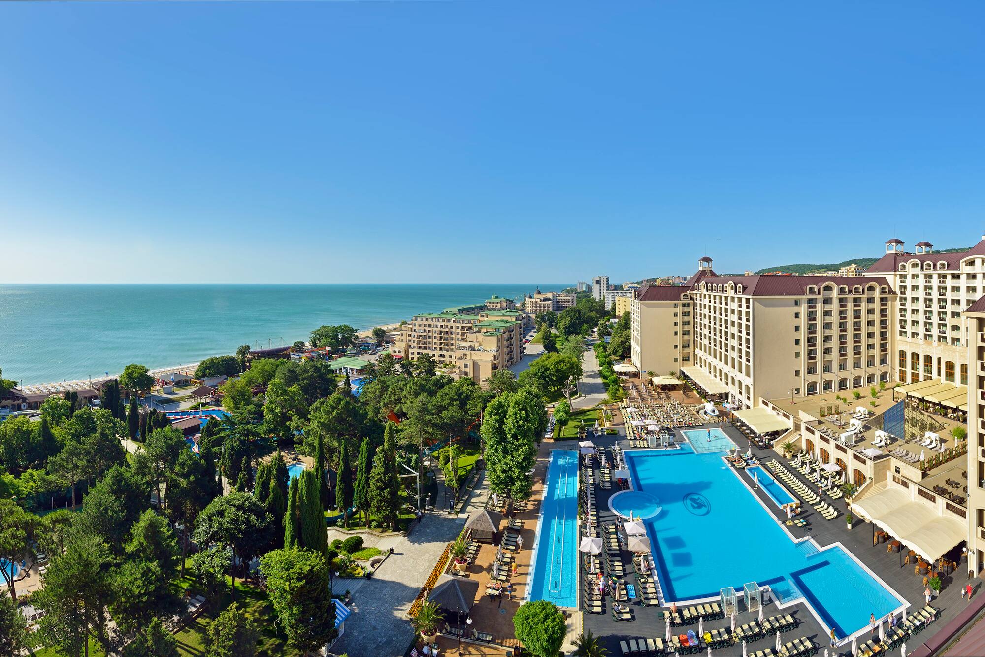 a swimming pool next to a beach
