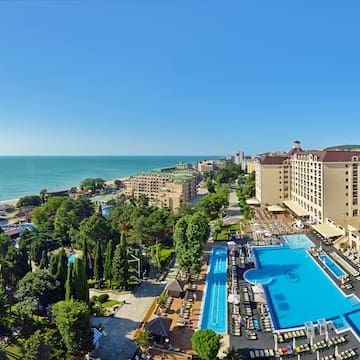 a swimming pool next to a beach