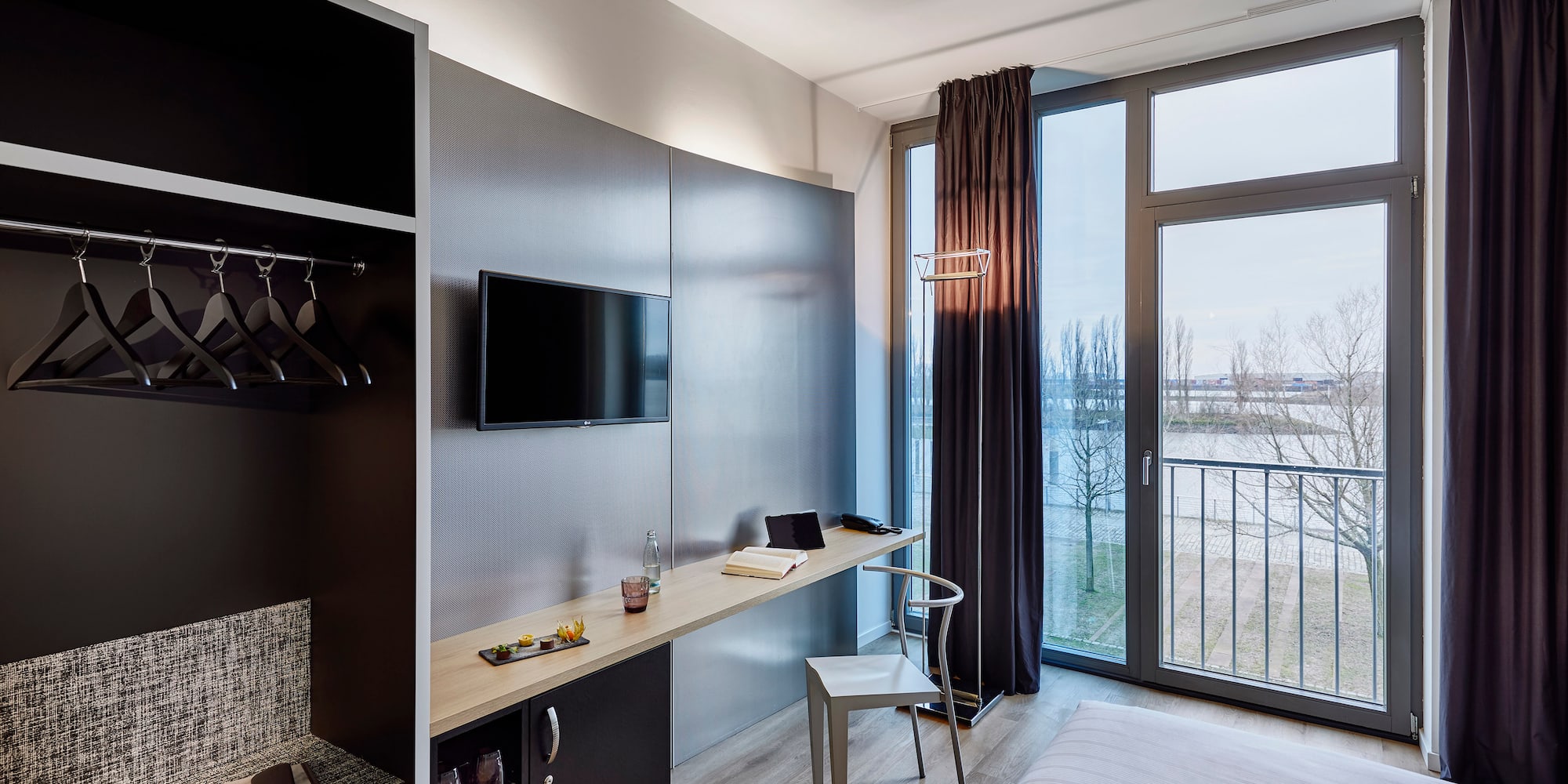 a room with a bed and a tv