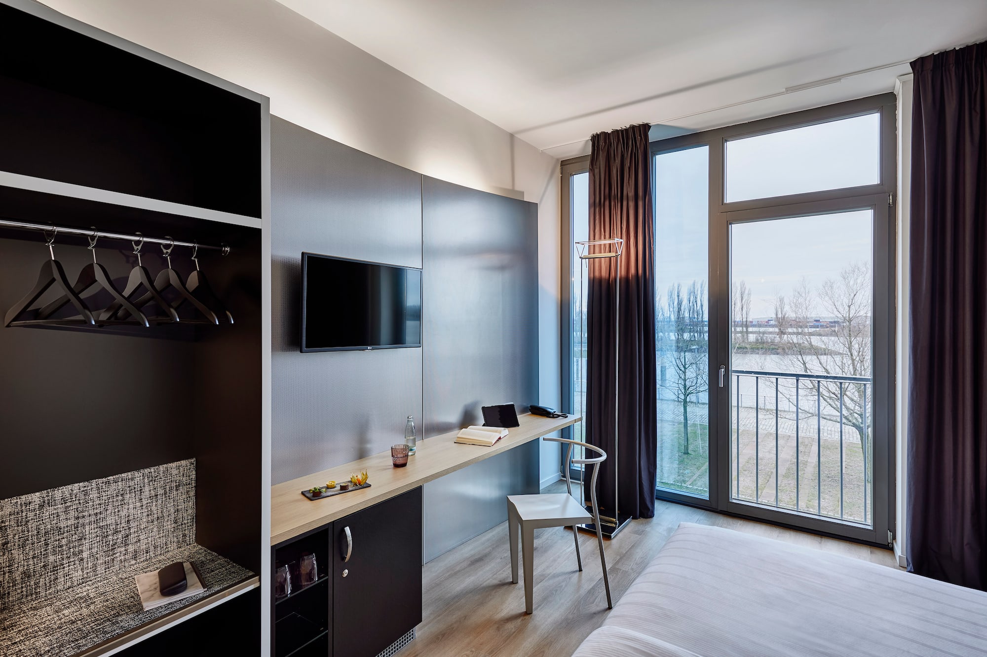 a room with a bed and a tv