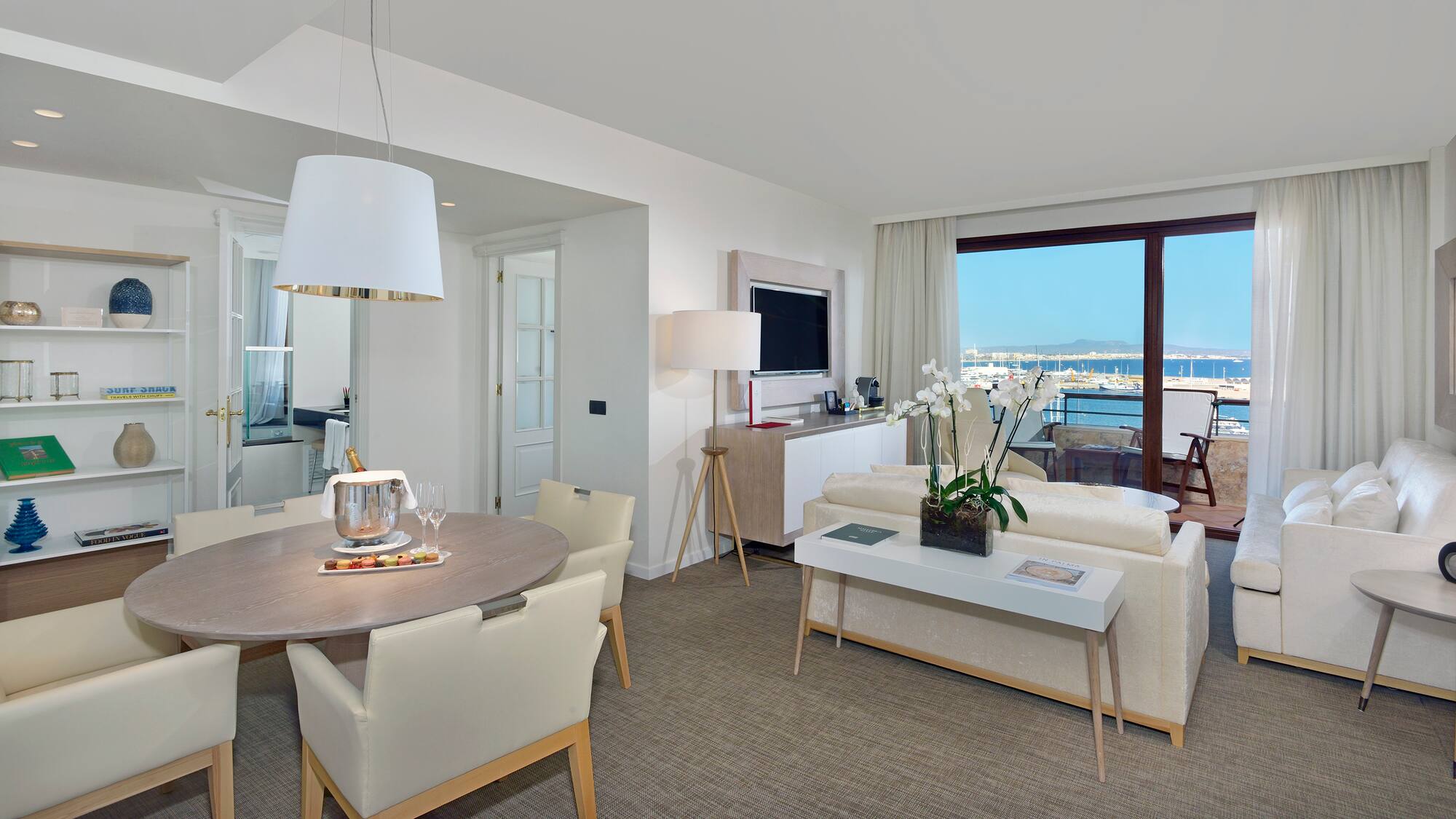 a living room with a table and chairs