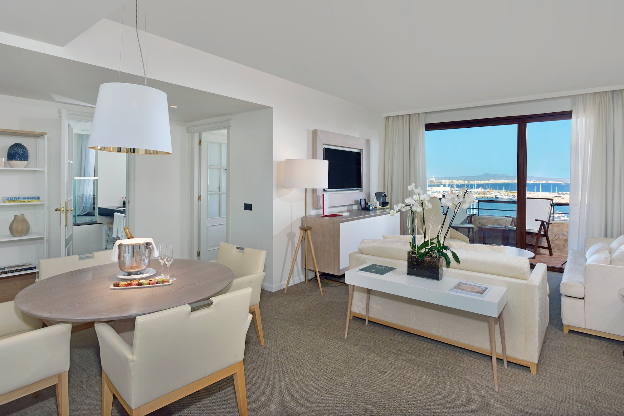 a living room with a table and chairs