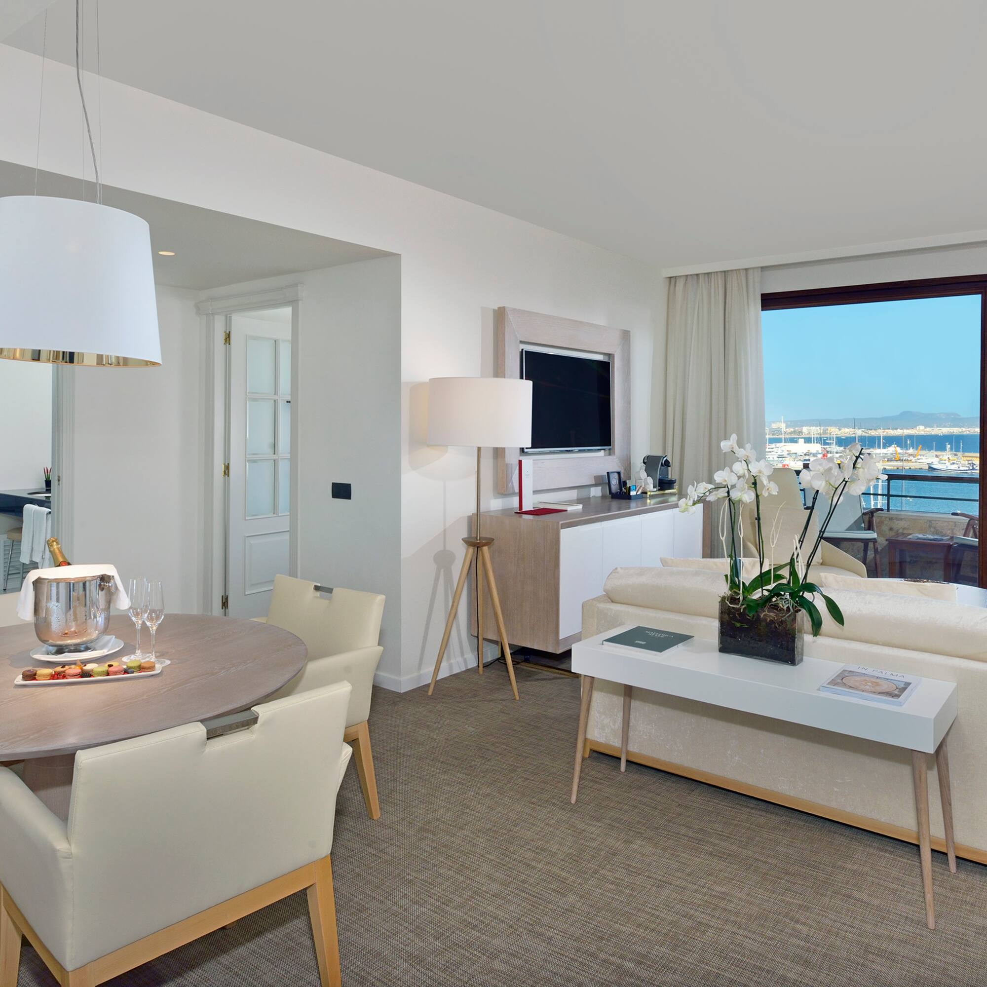 a living room with a table and chairs