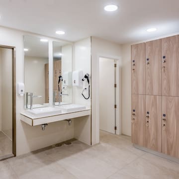 a bathroom with mirrors and cabinets