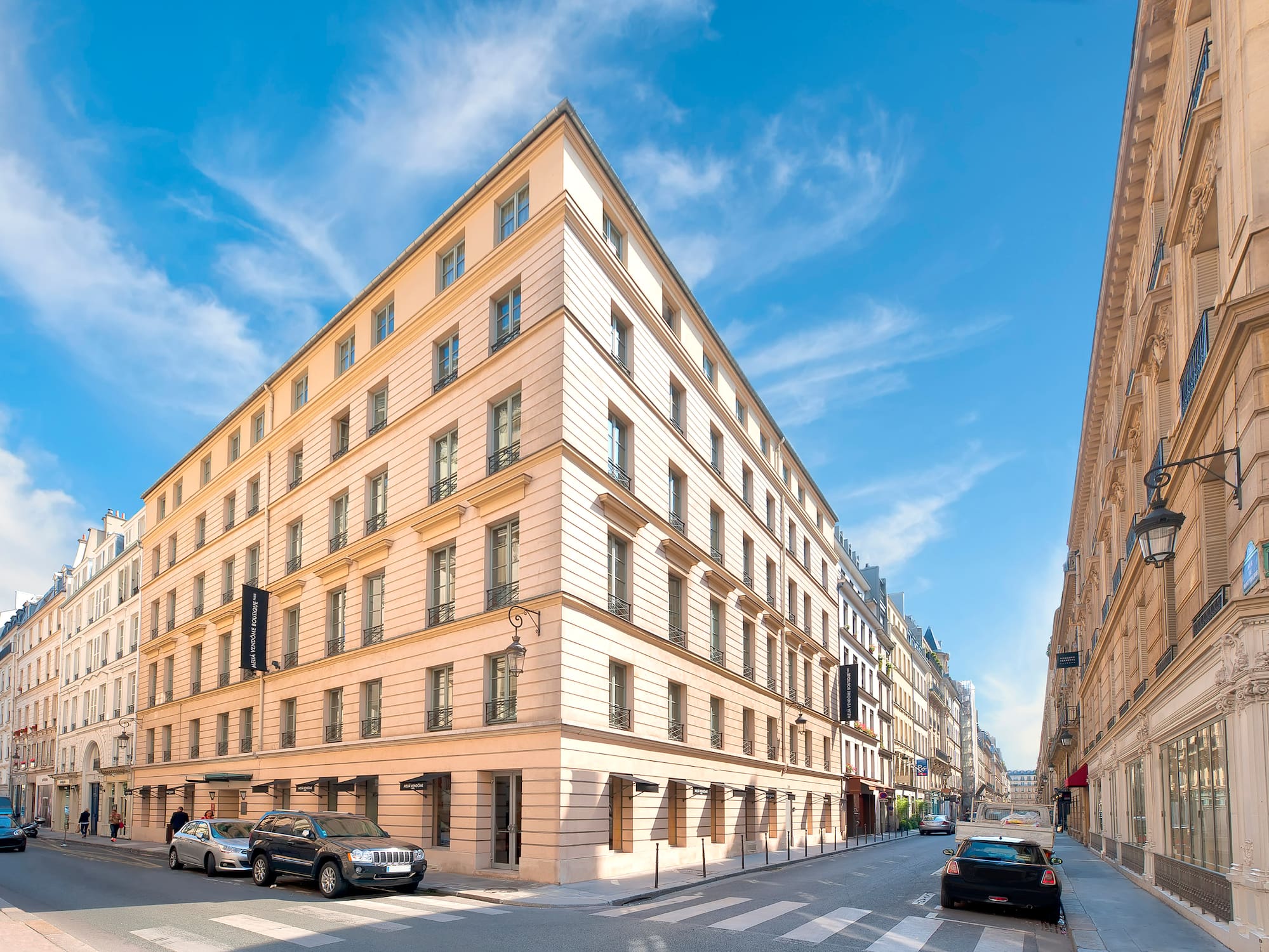 a street with cars and buildings