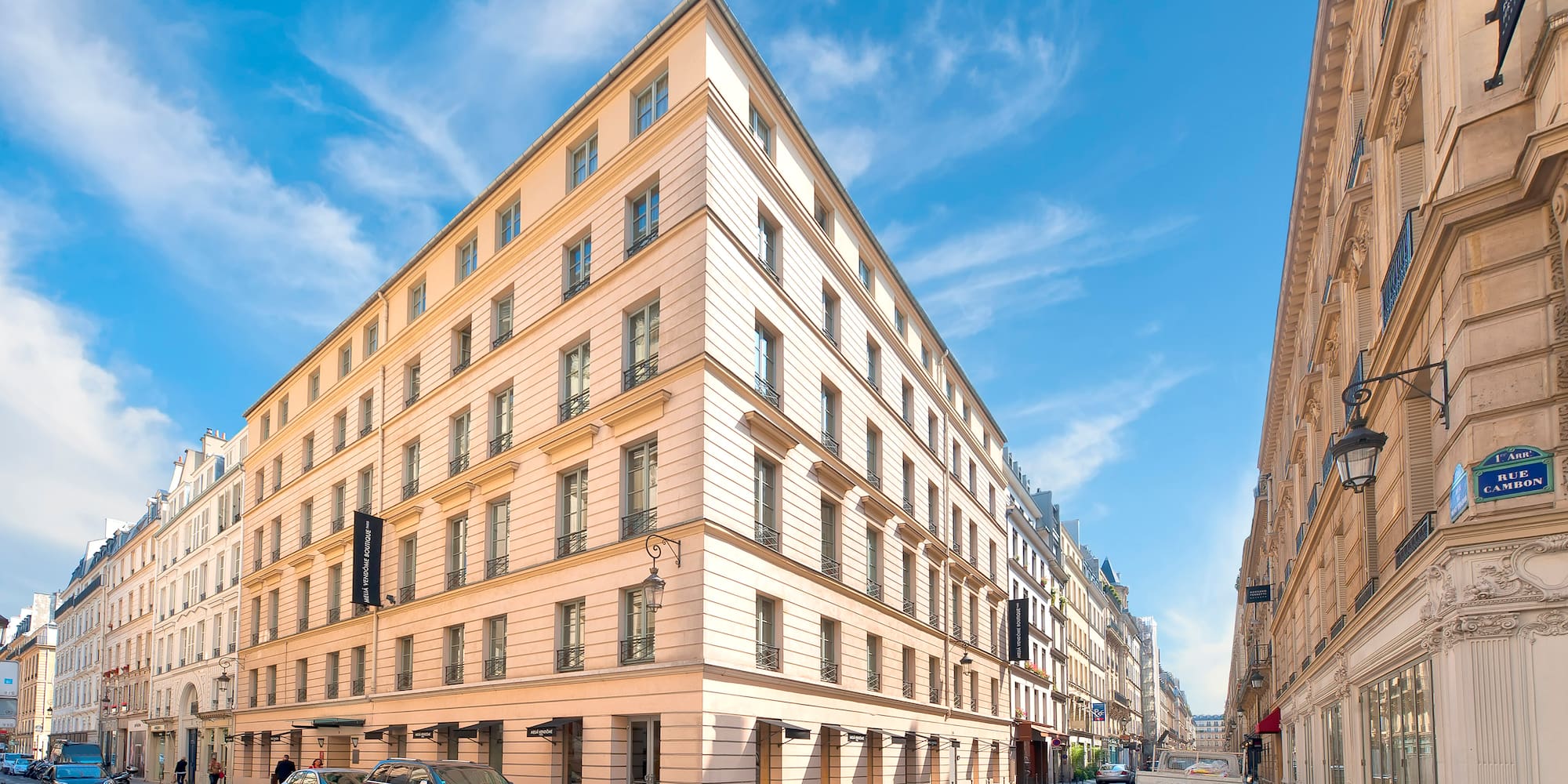 a street with cars and buildings