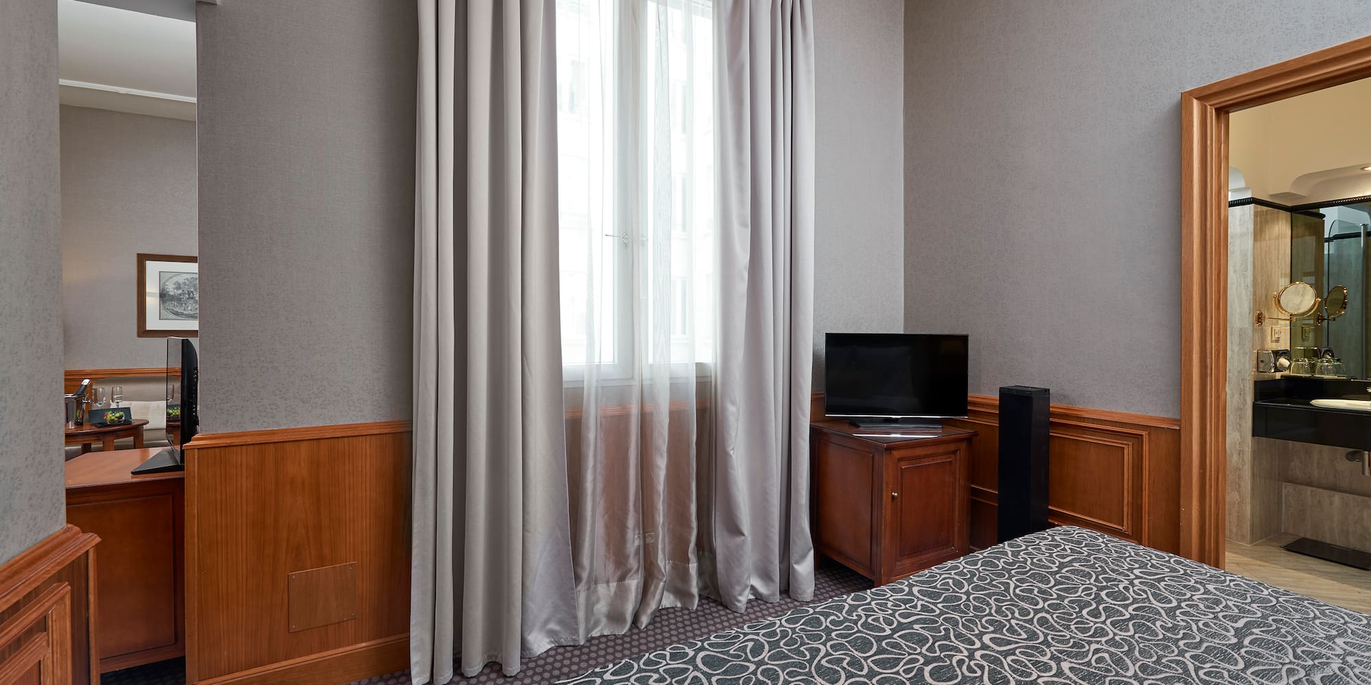 a room with a bed and a tv