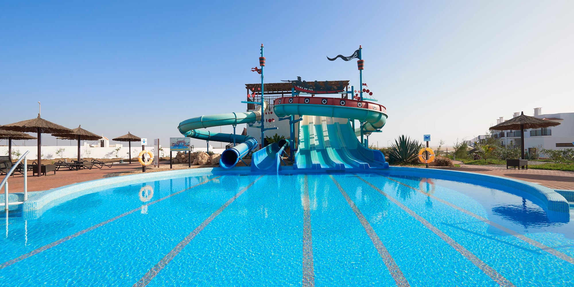 a water slide in a pool