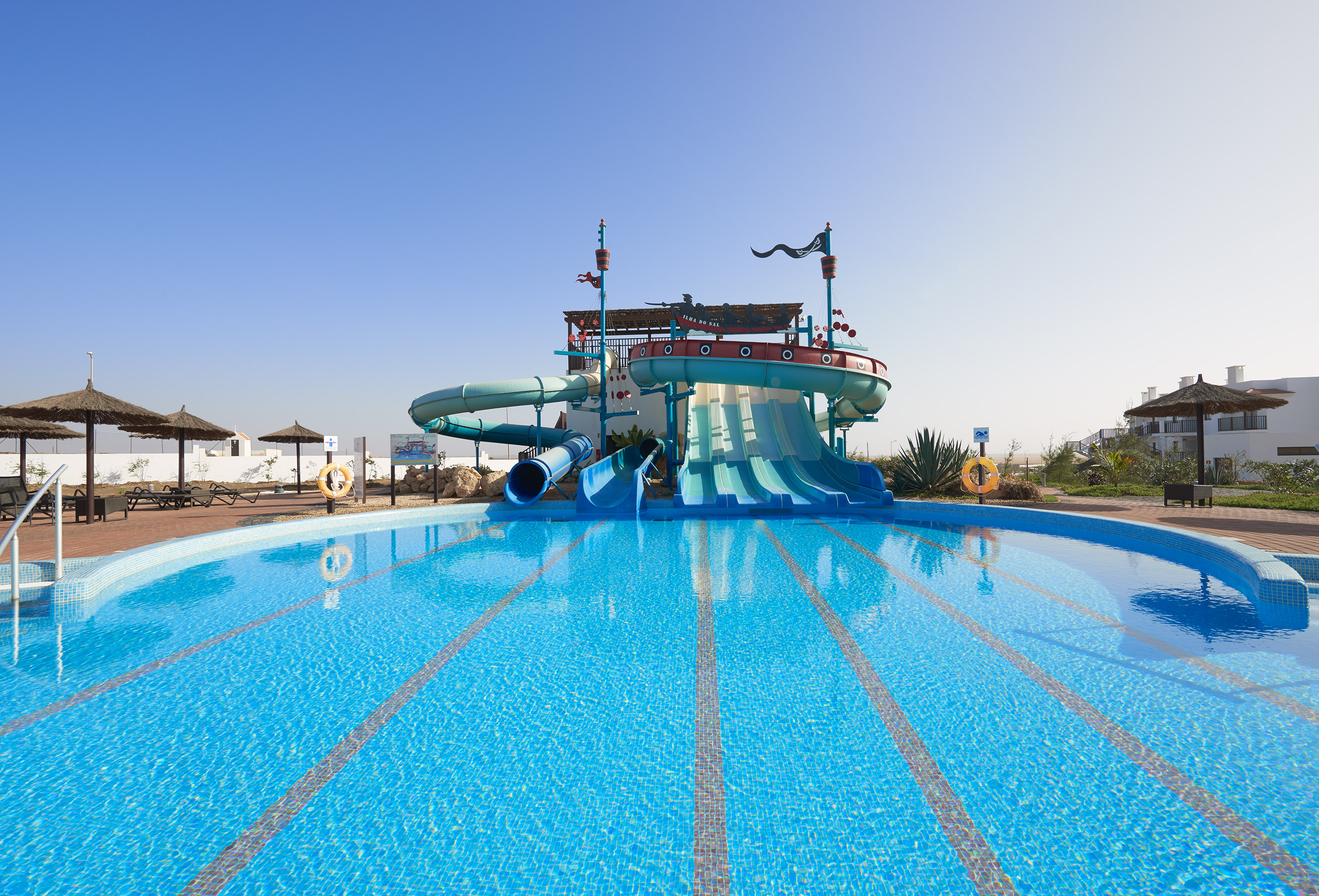 a water slide in a pool