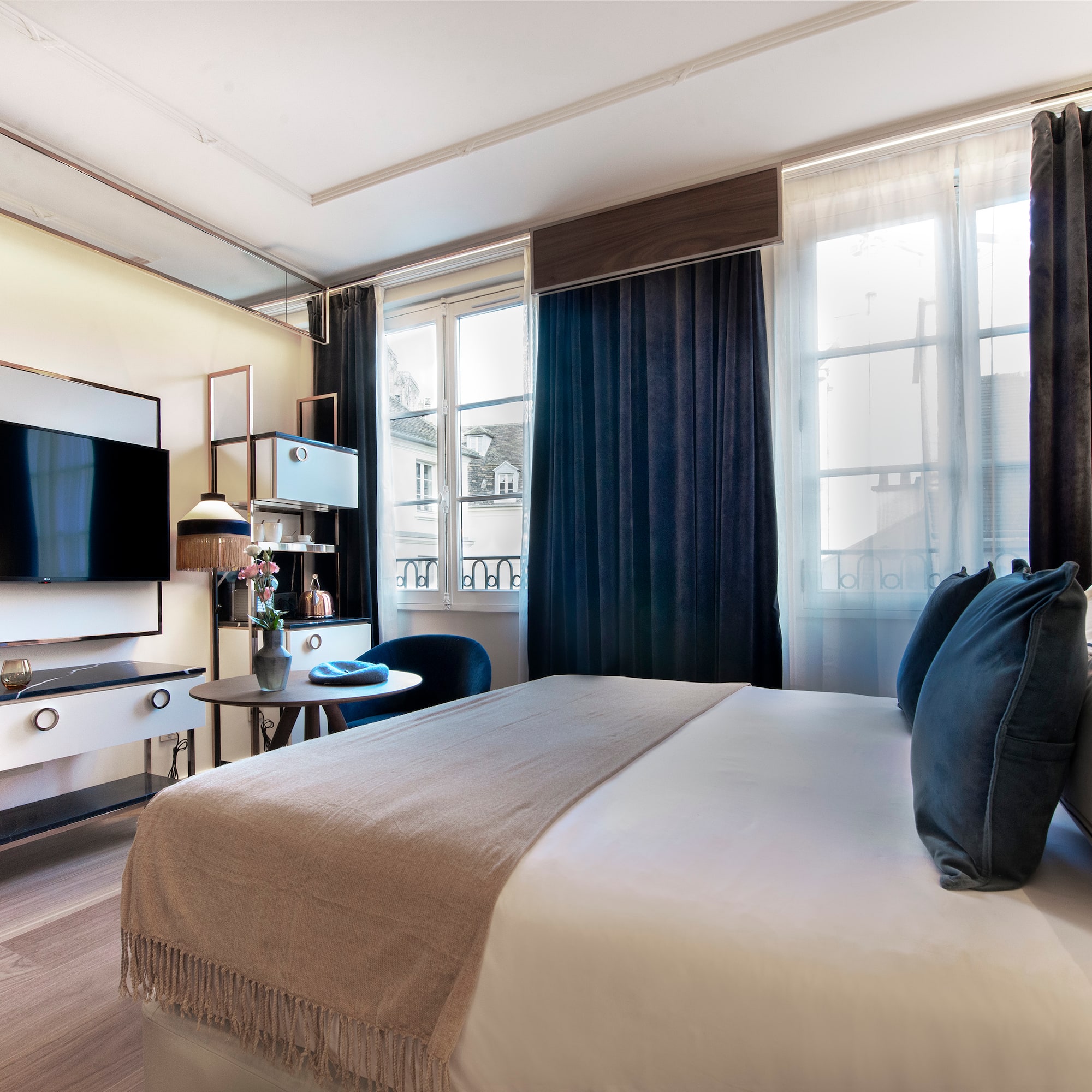 a bedroom with a large bed and a tv