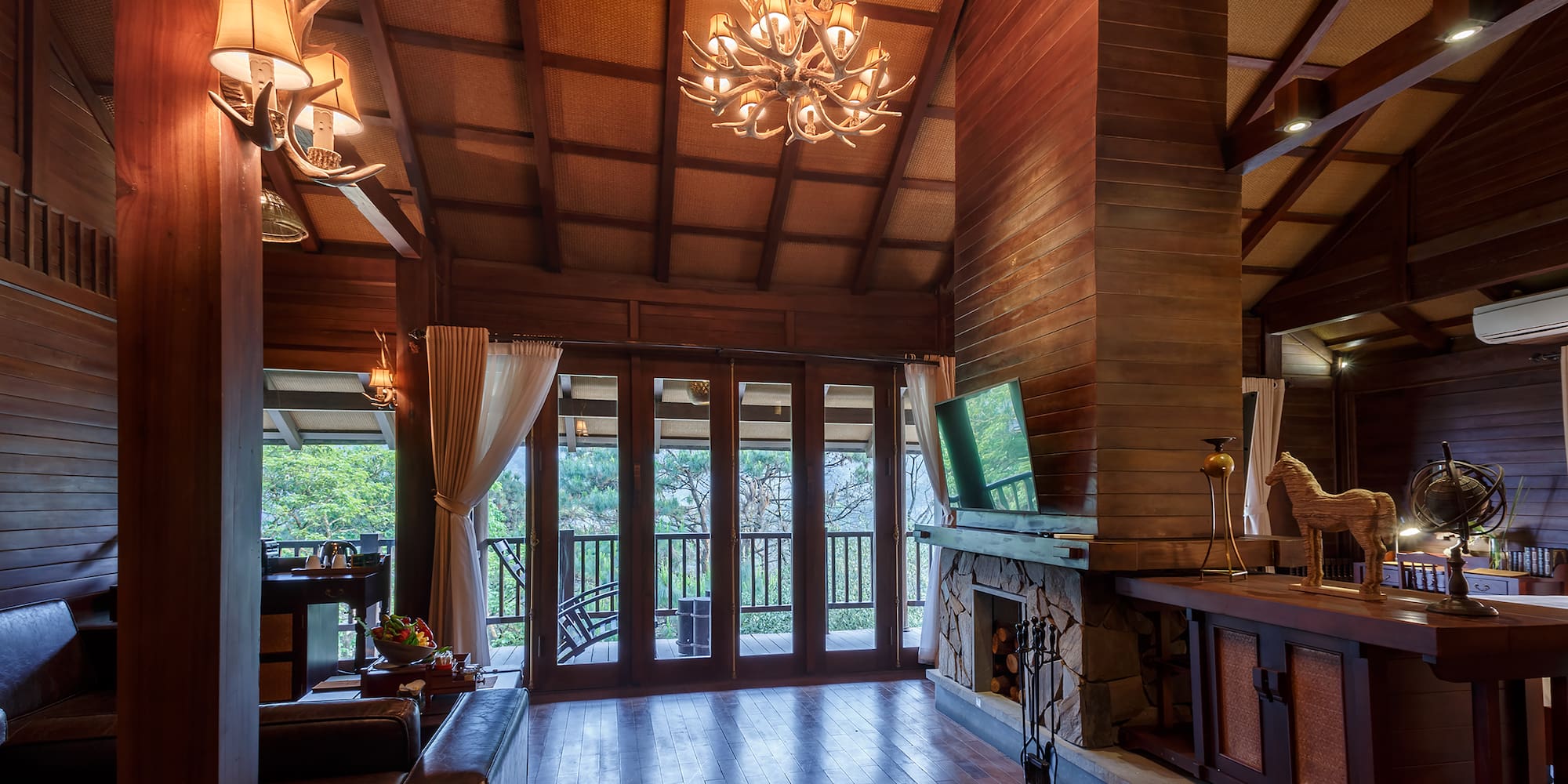 a room with a television and a fireplace