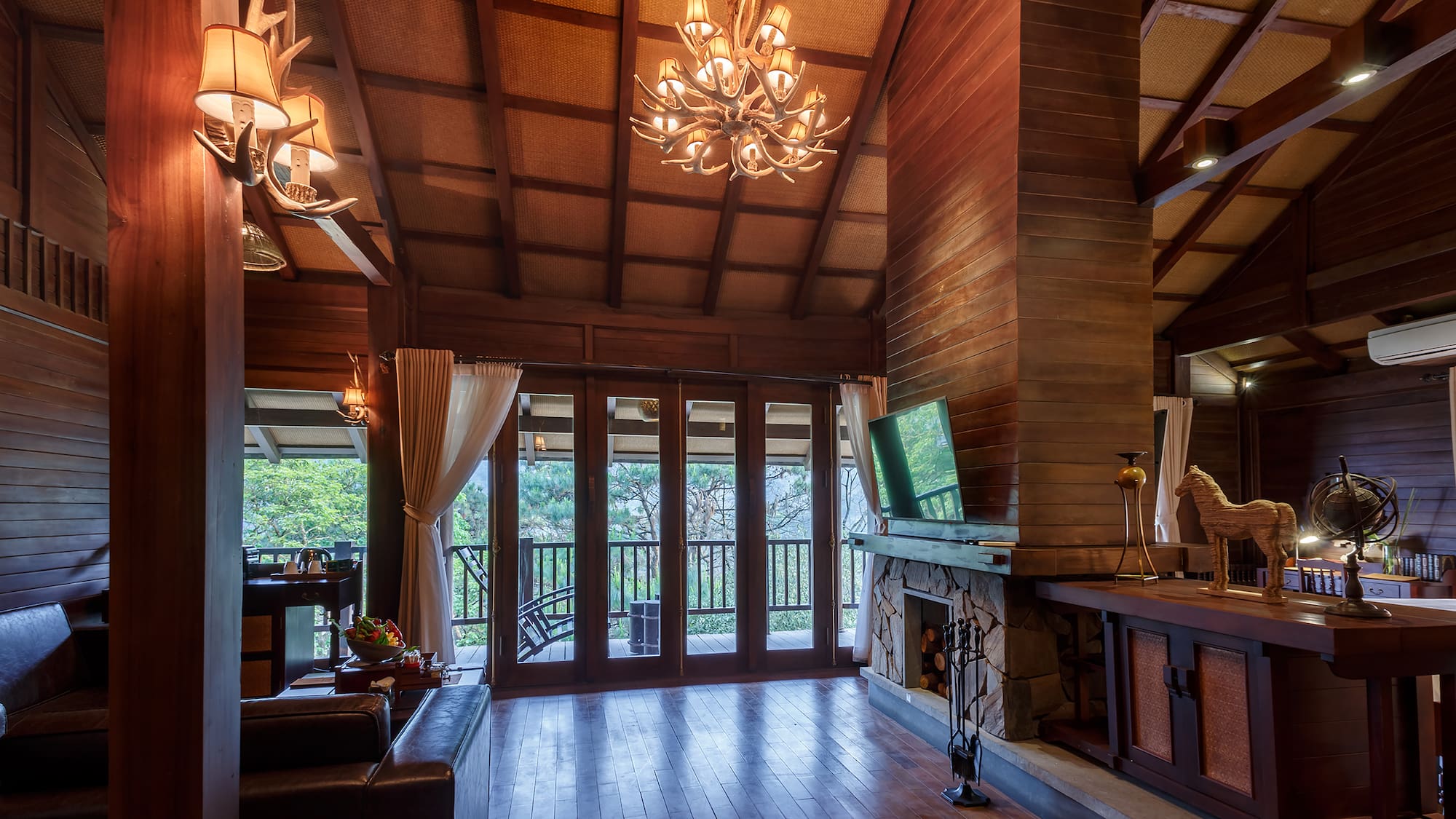 a room with a television and a fireplace