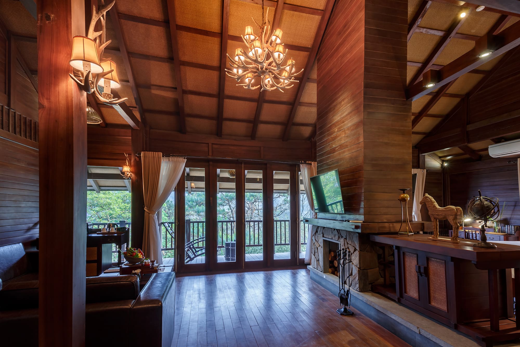 a room with a television and a fireplace