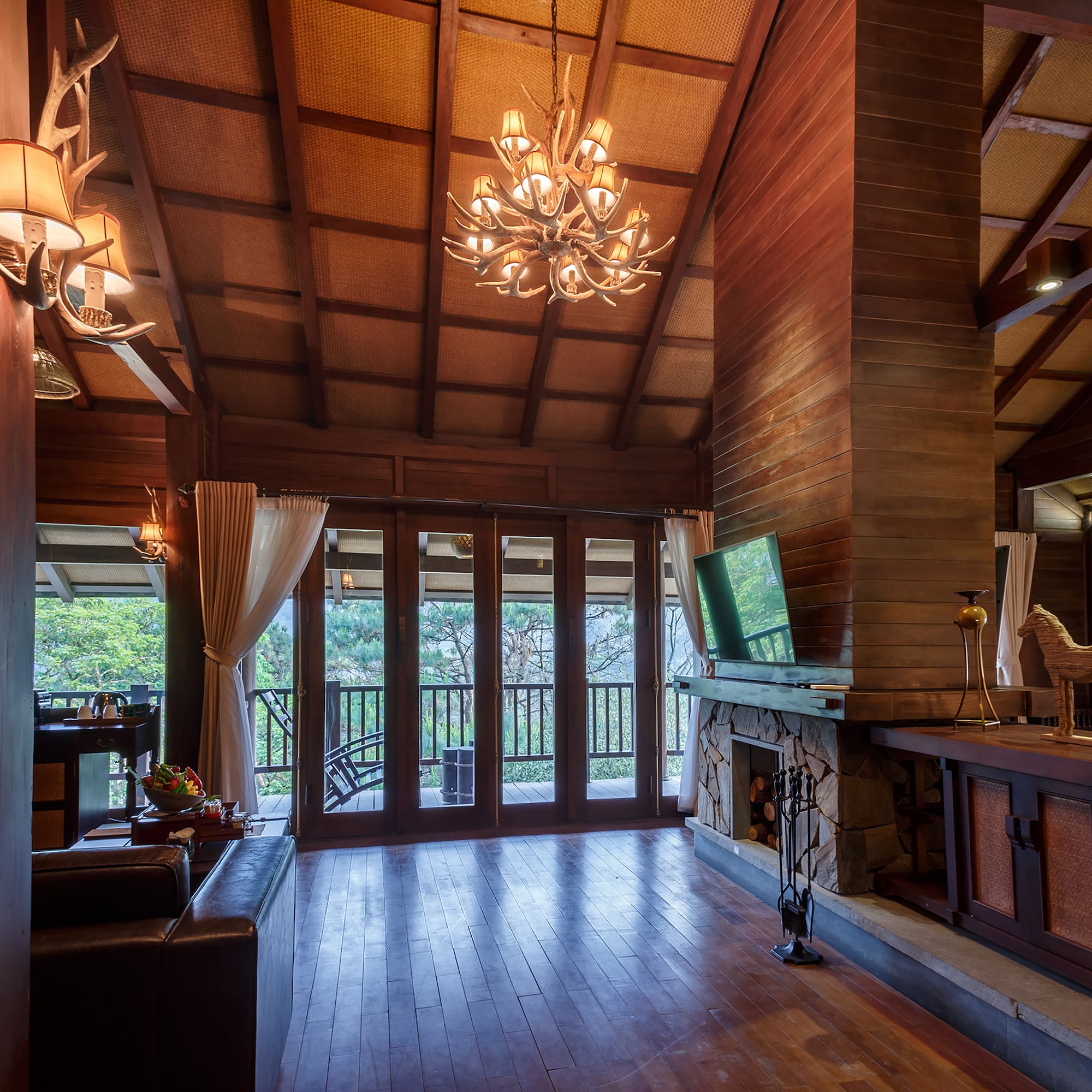 a room with a television and a fireplace