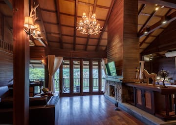 a room with a television and a fireplace