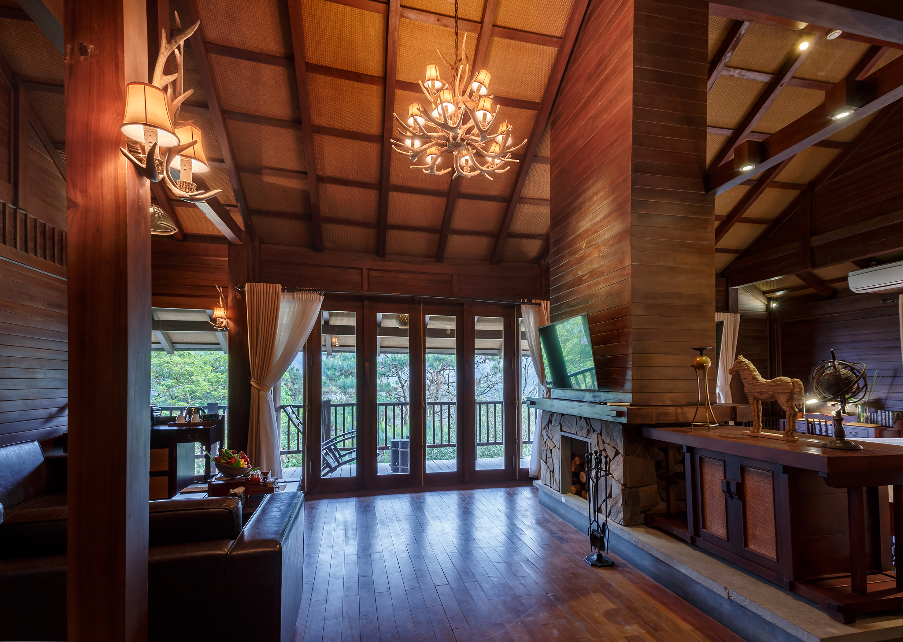 a room with a television and a fireplace