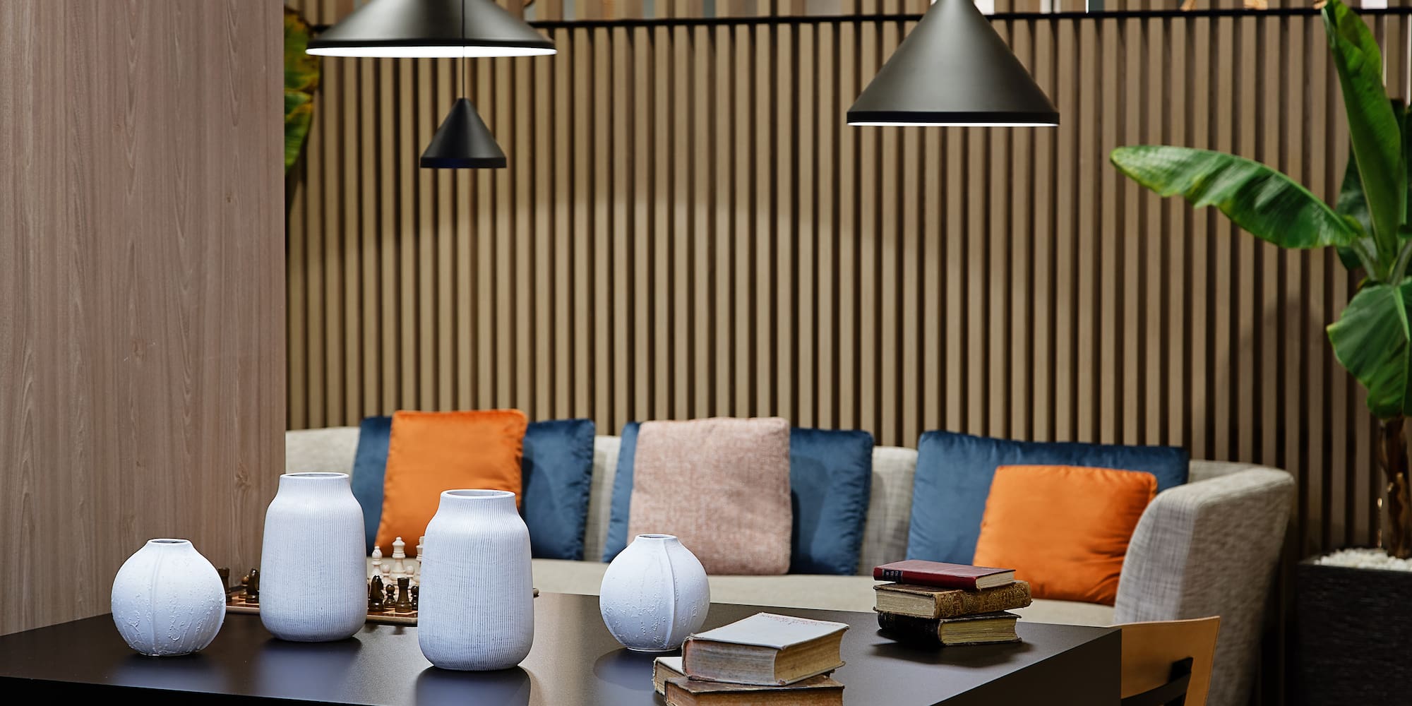 a table with books and vases on it