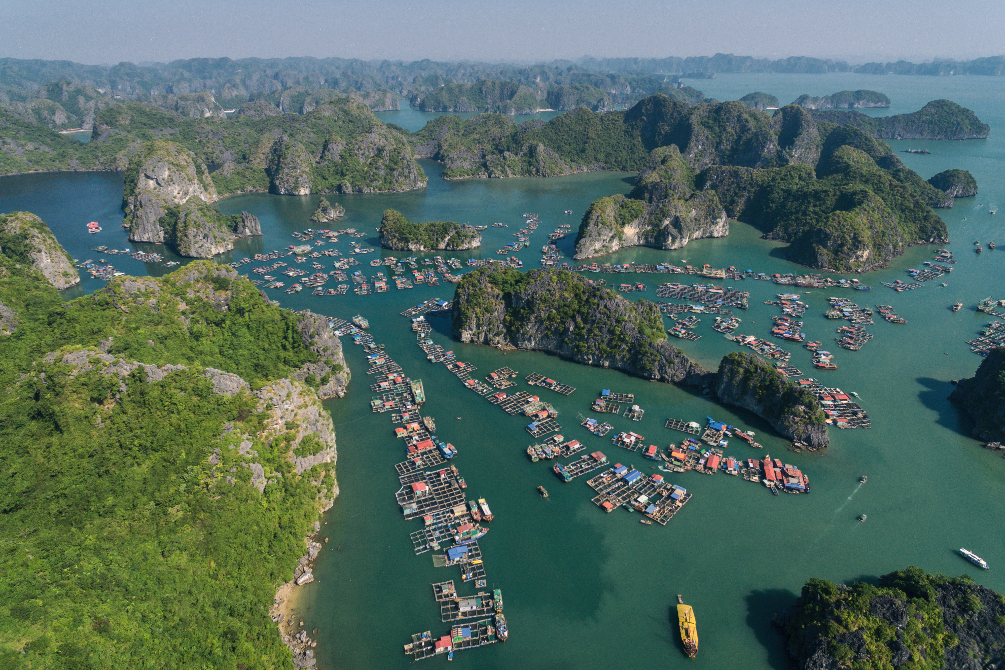aerial view of a body of water with boats and islands