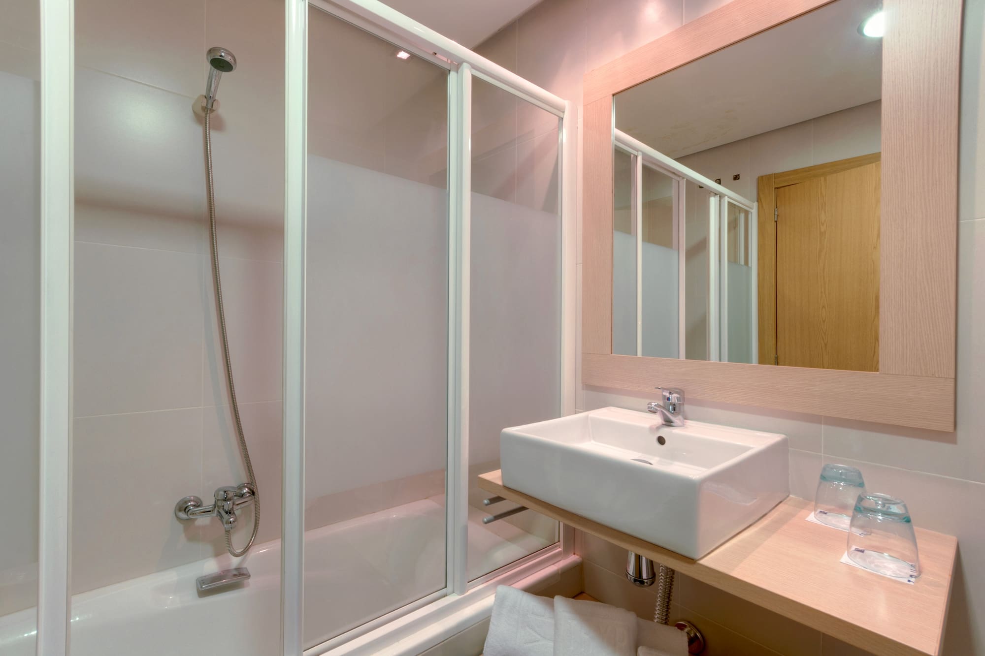 a bathroom with a sink and shower