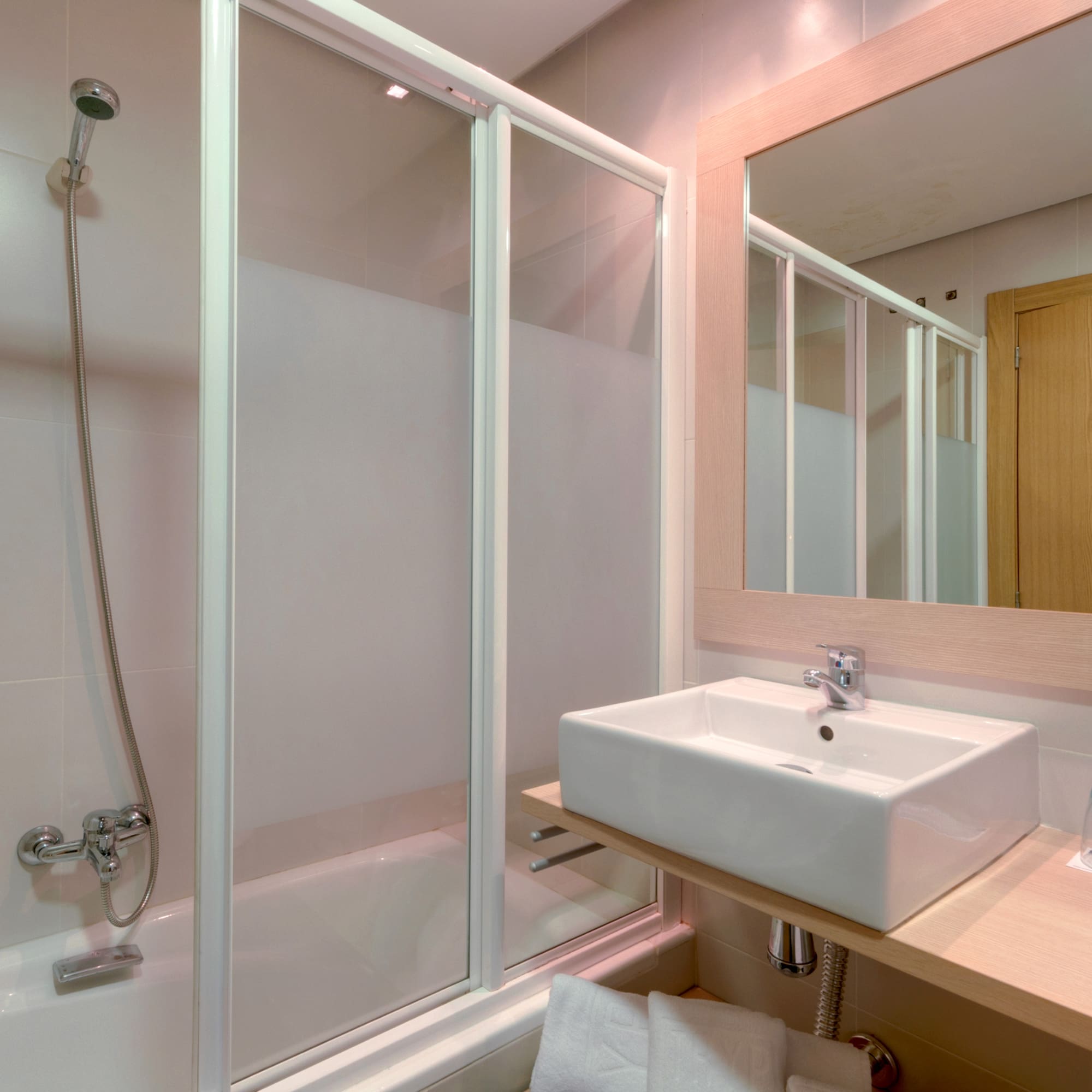 a bathroom with a sink and shower