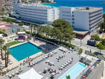a swimming pool and buildings by the water