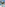 Coastal resort with pools, sunbathers, palm trees, hotels, and blue sea.