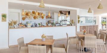 a restaurant with tables and chairs