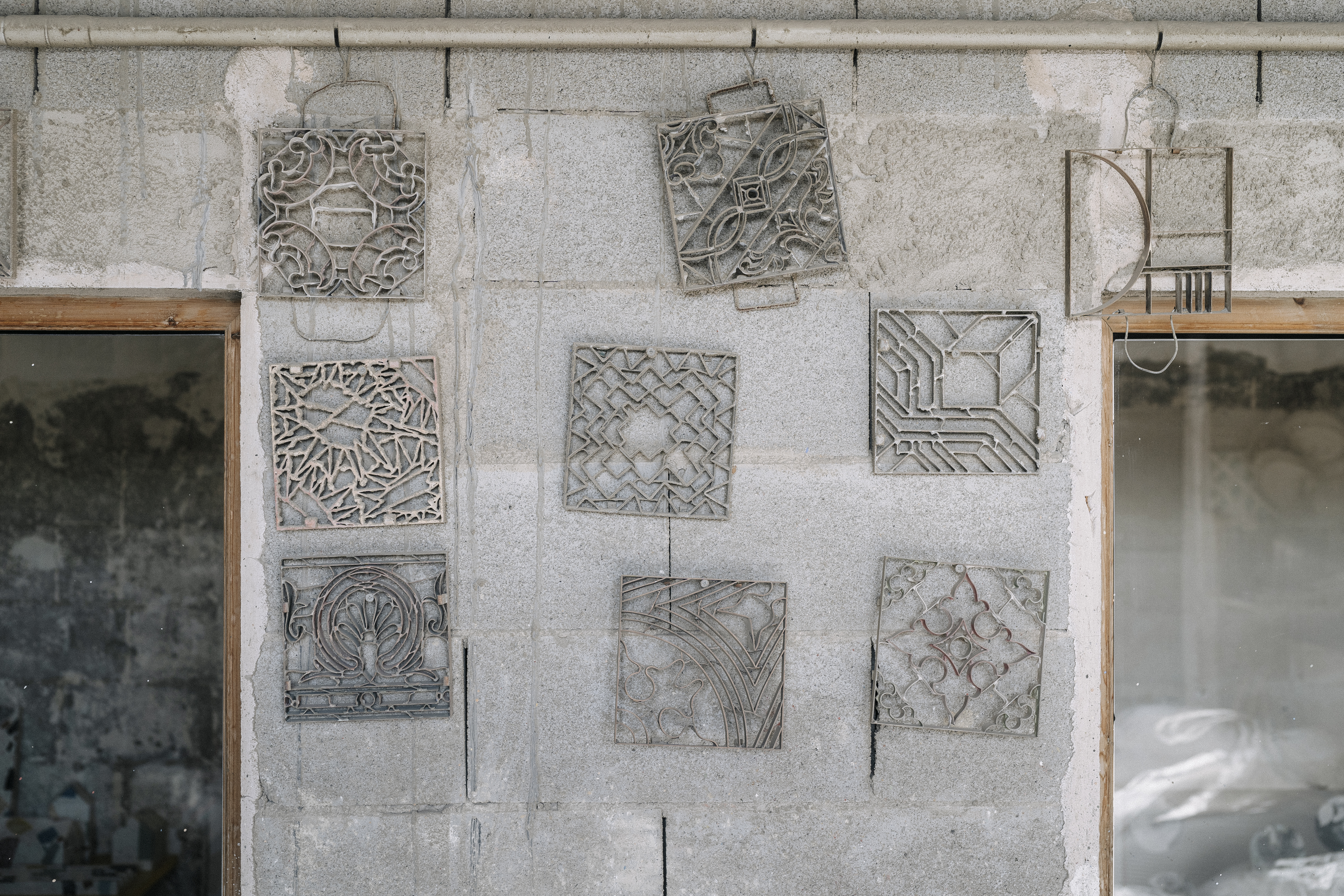 a group of metal art on a wall