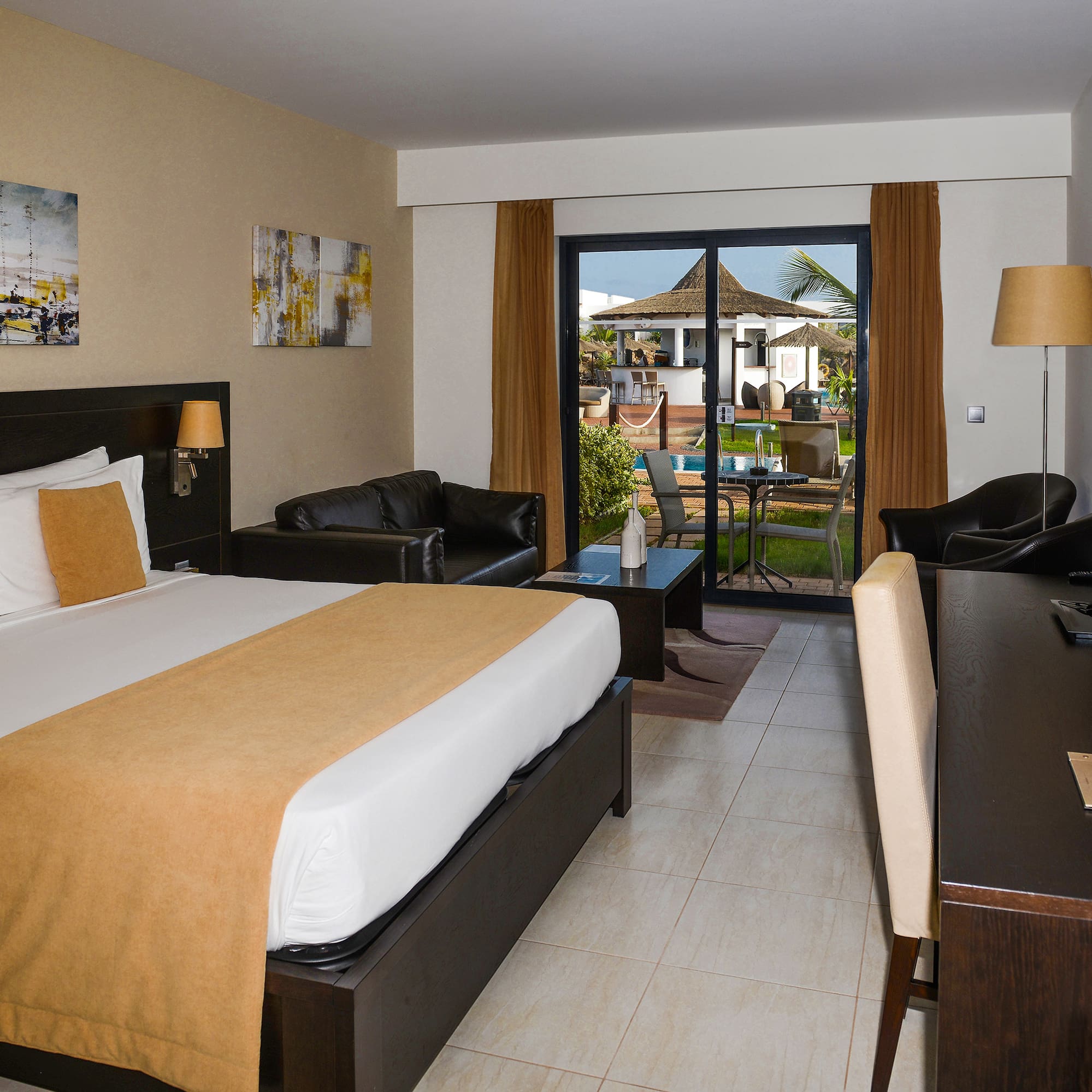 a room with a bed and a desk and chair