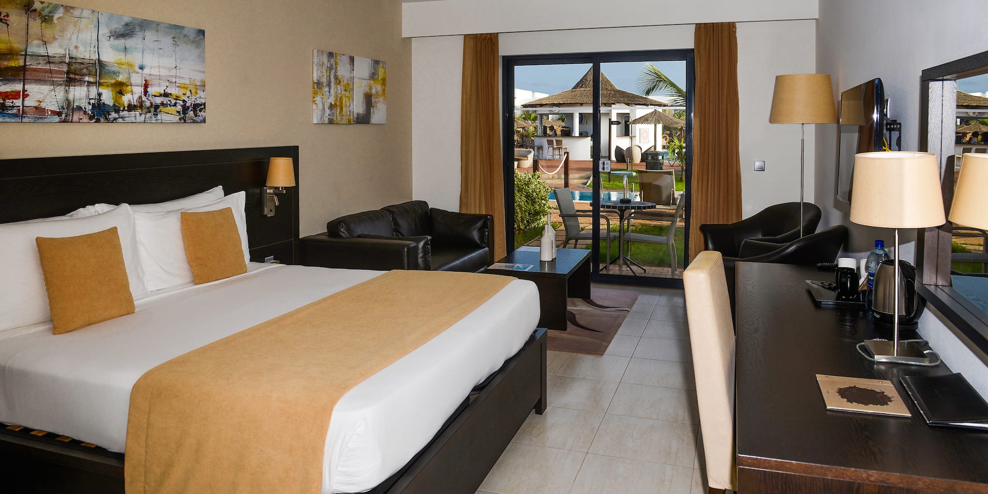 a room with a bed and a desk and chair