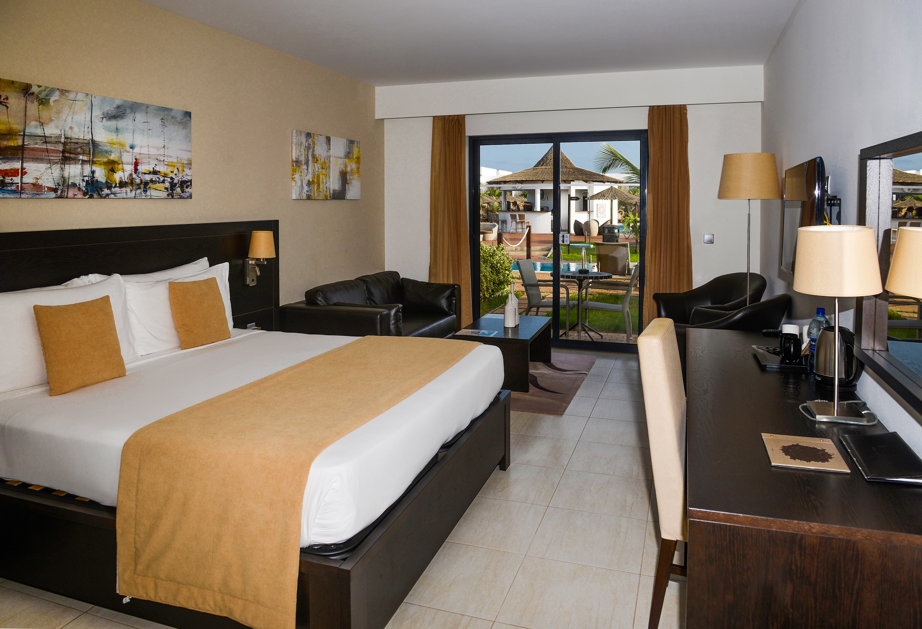 a room with a bed and a desk and chair