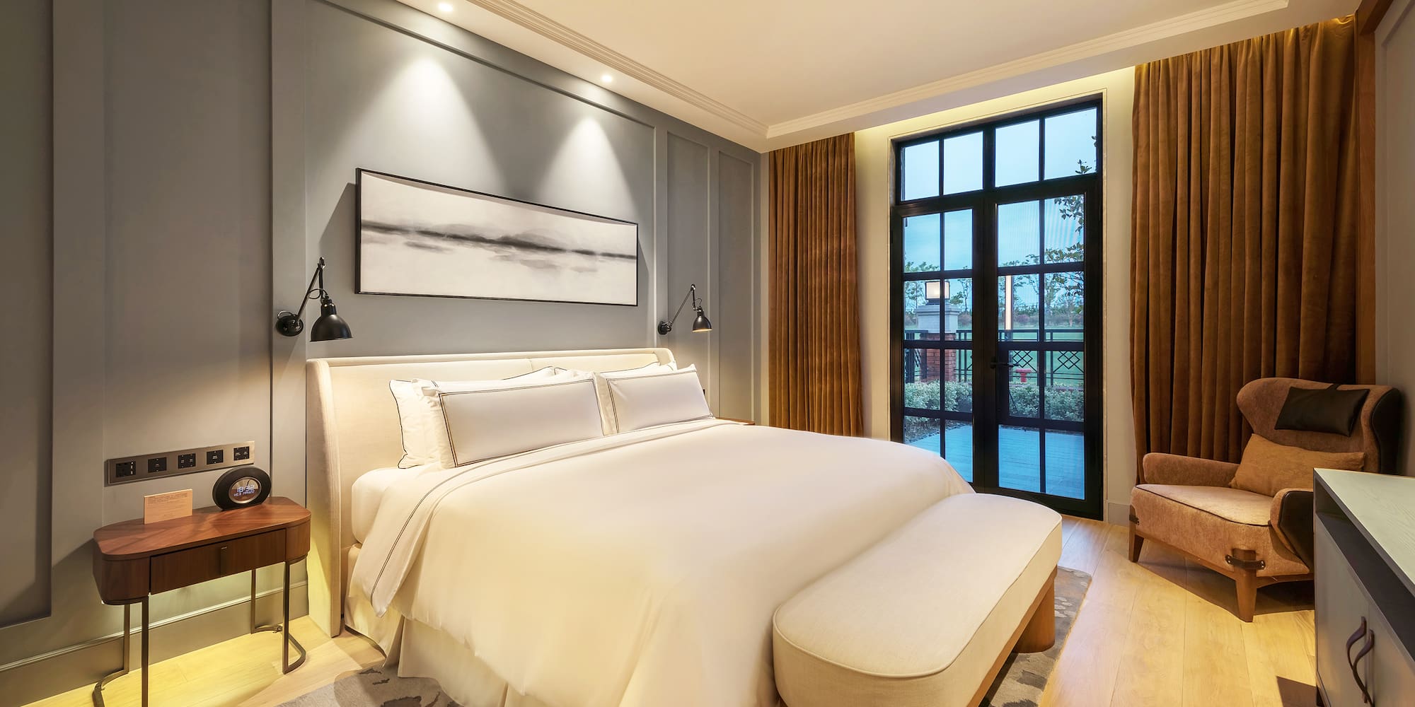 a bedroom with a bed and a chair