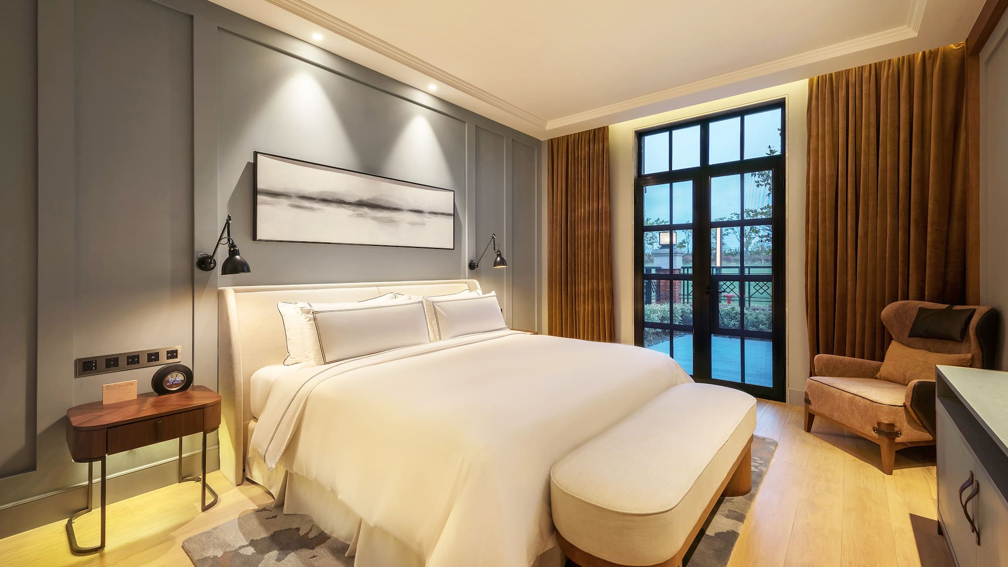 a bedroom with a bed and a chair