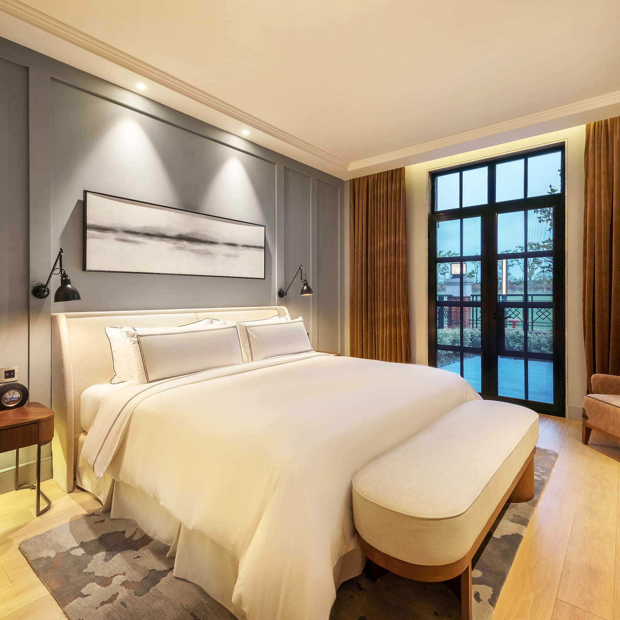 a bedroom with a bed and a chair