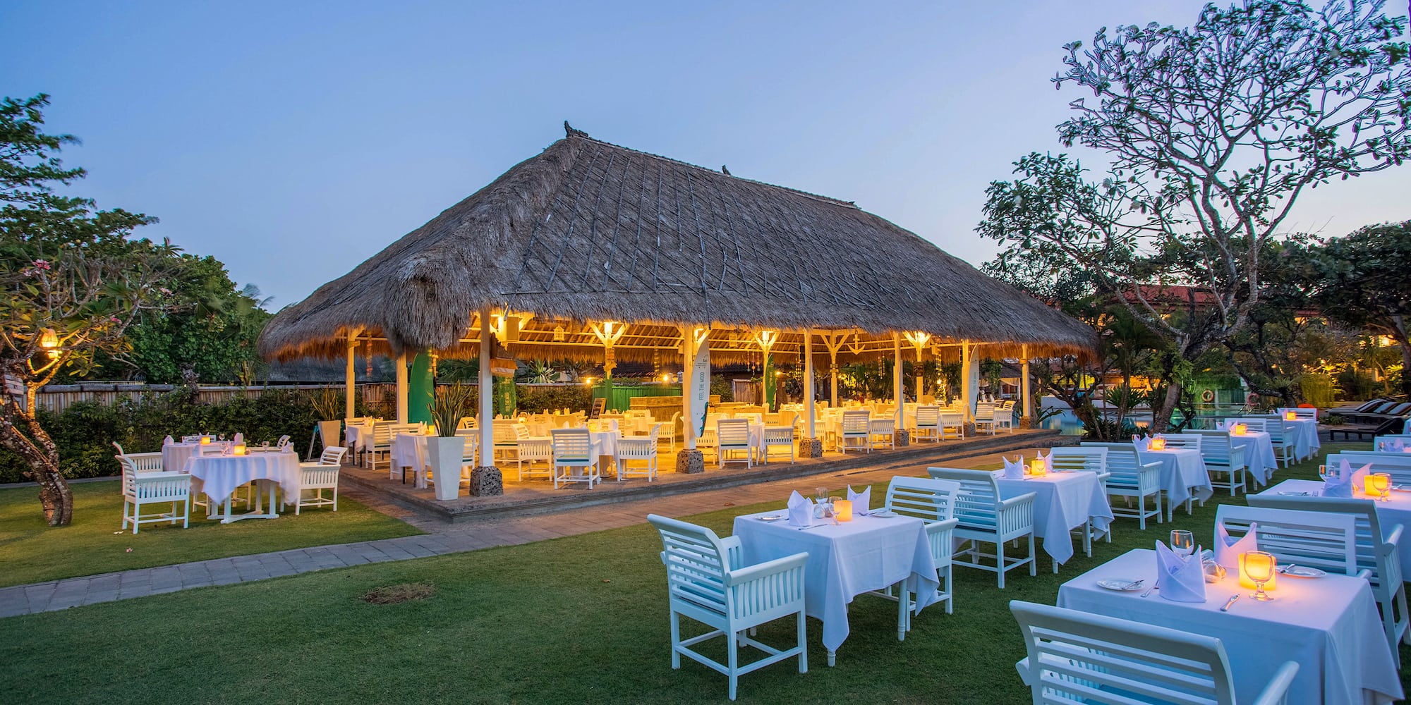 a large outdoor restaurant with tables and chairs