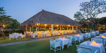 a large outdoor restaurant with tables and chairs