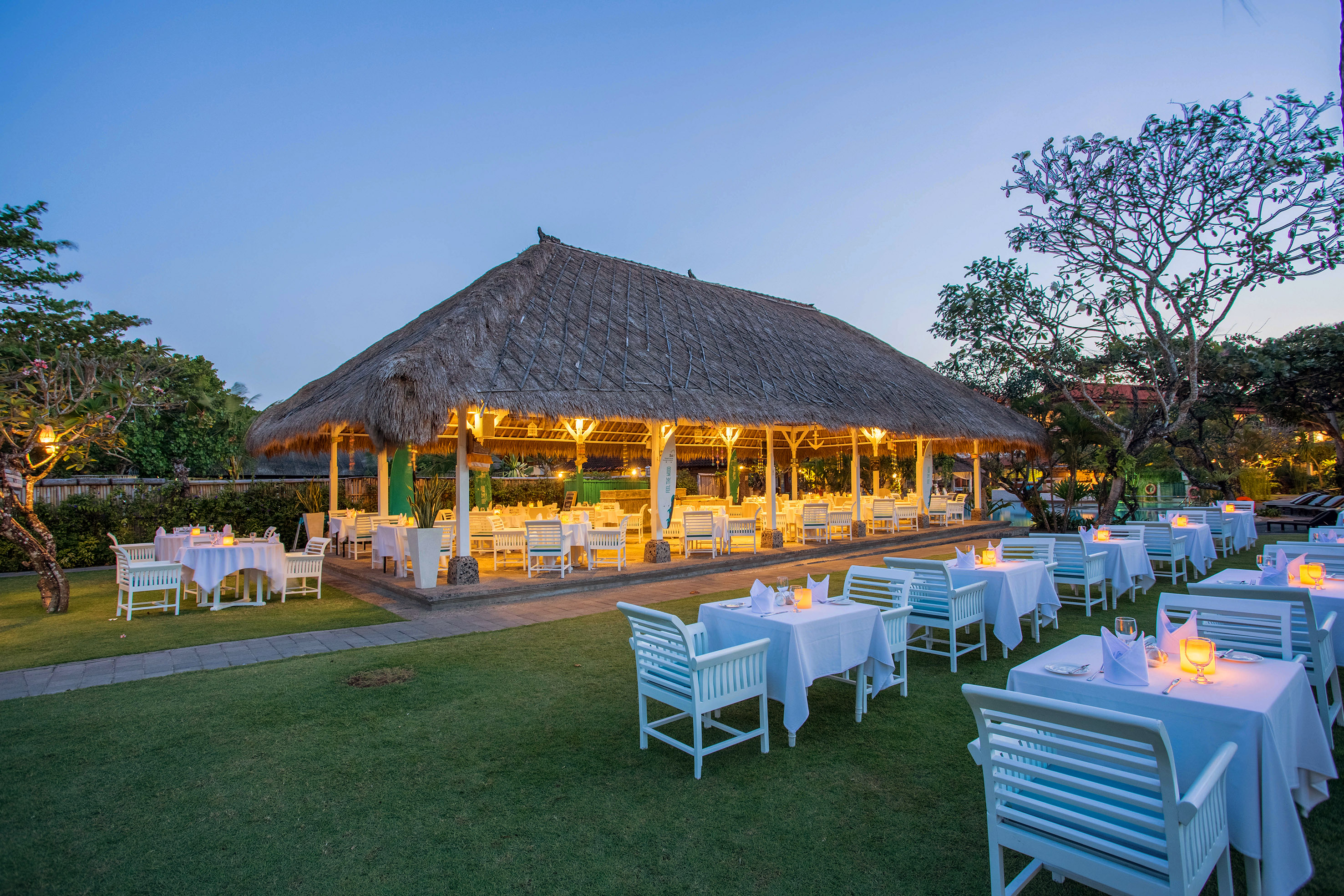 a large outdoor restaurant with tables and chairs