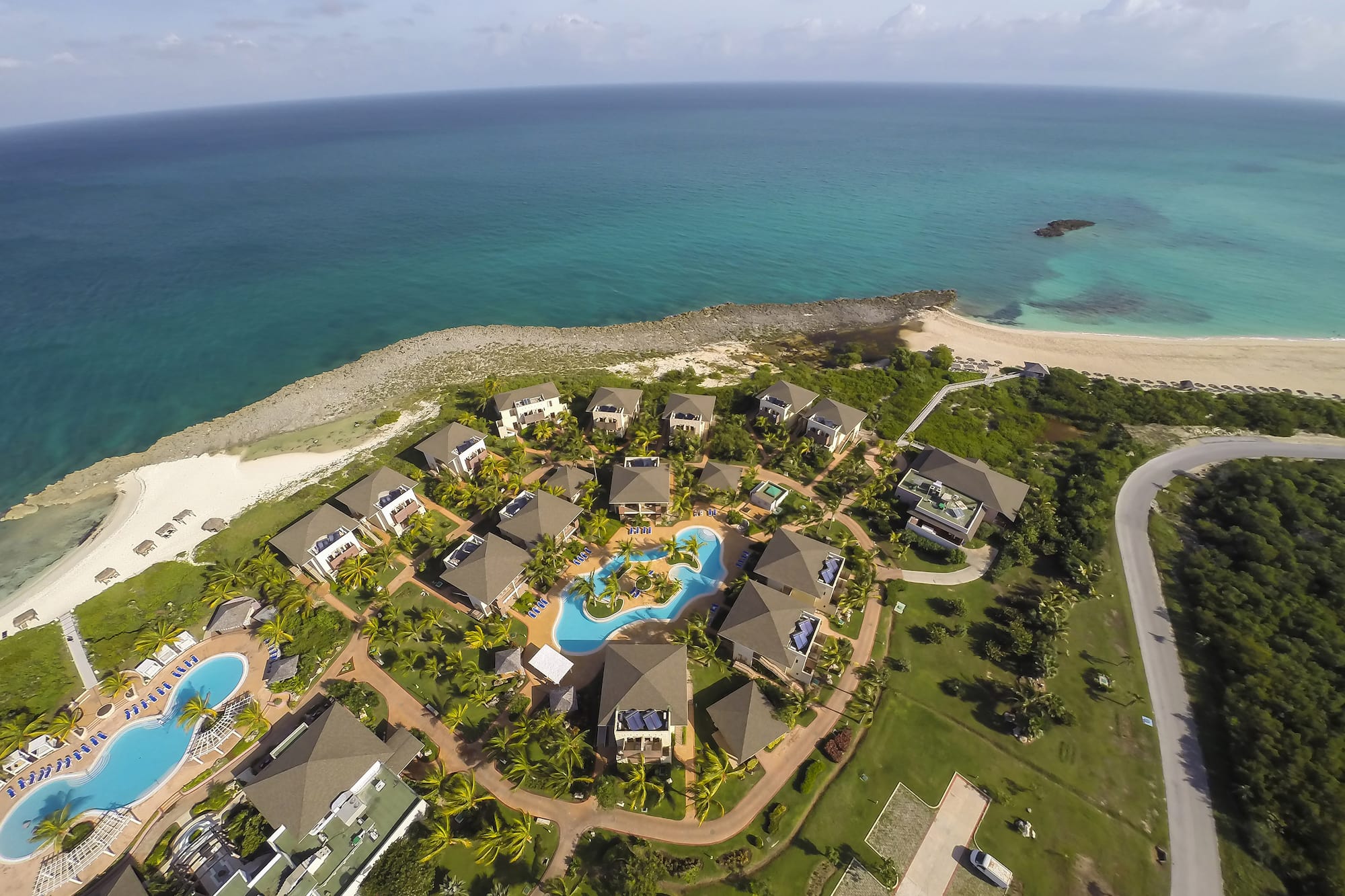a group of buildings next to a body of water