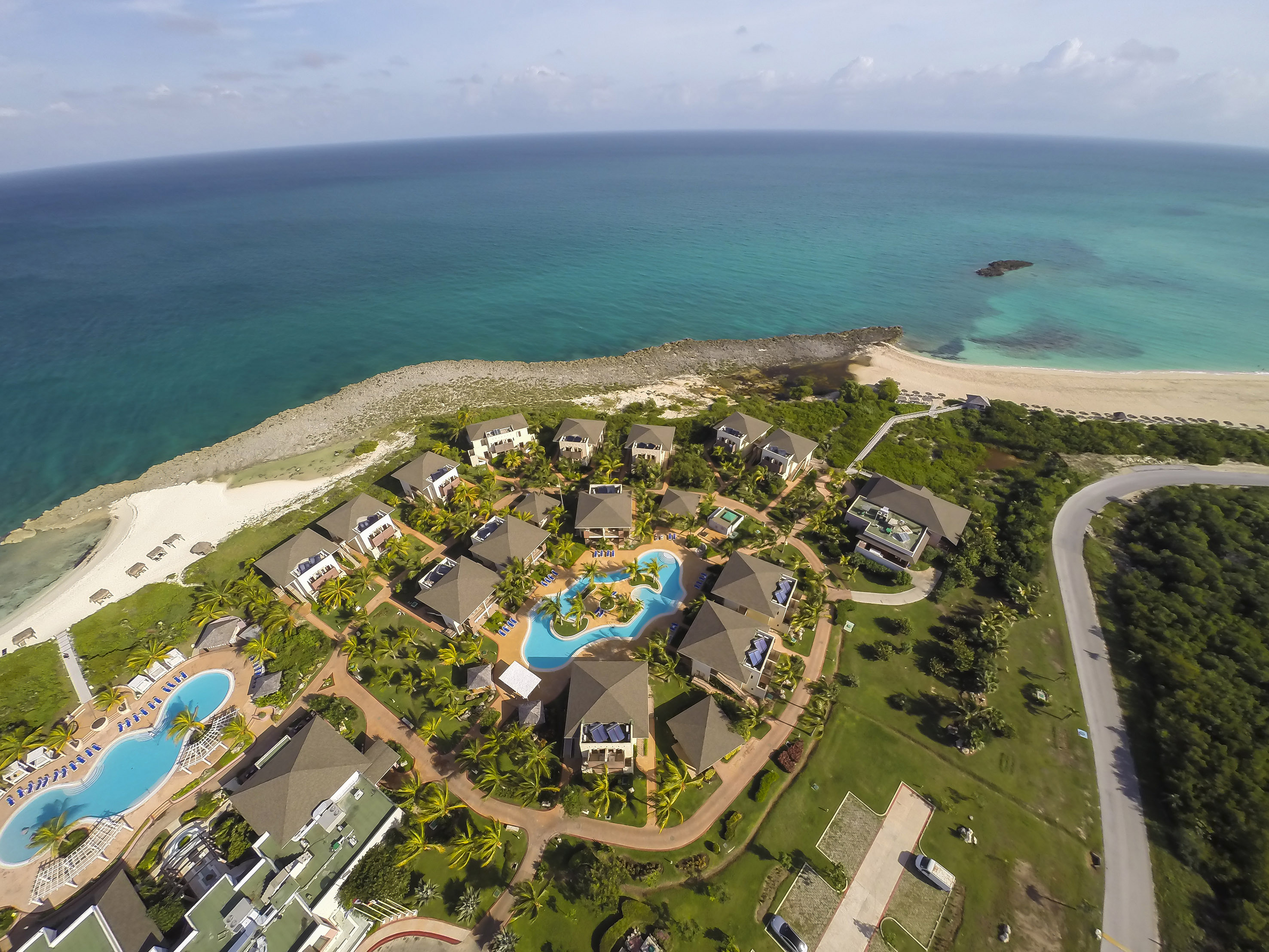 a group of buildings next to a body of water