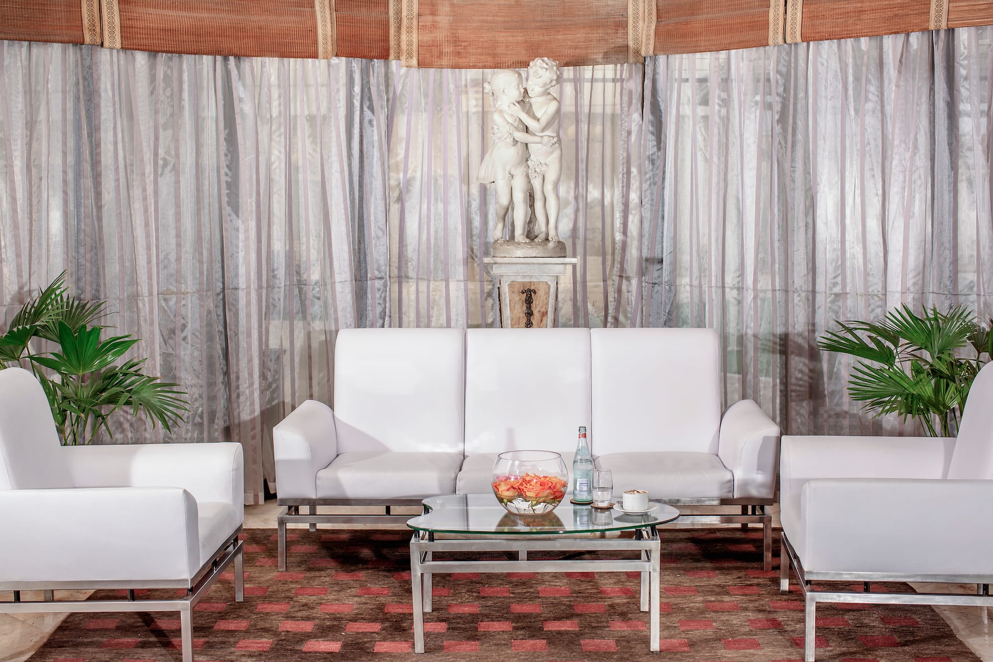 a white couches and a table in a room