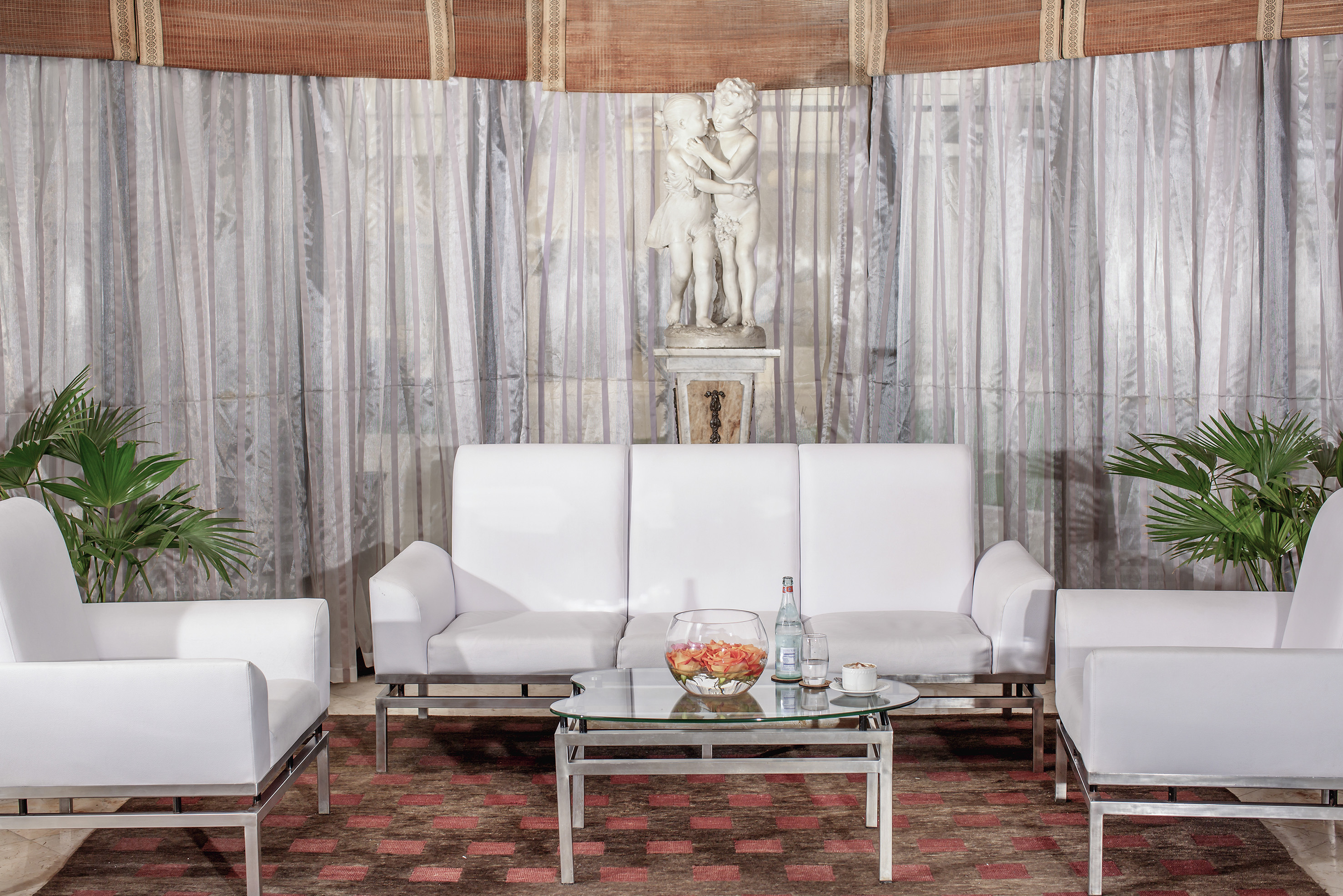 a white couches and a table in a room