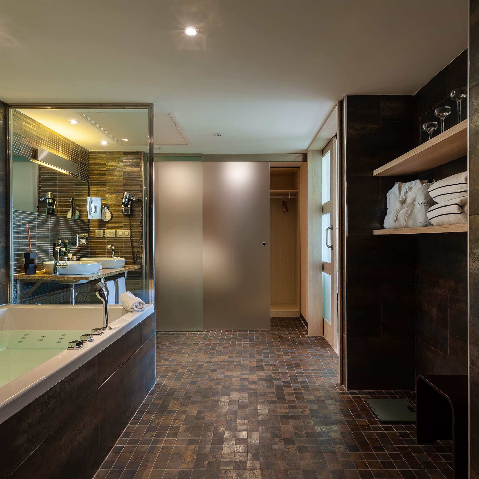 a bathroom with a bathtub and a shower